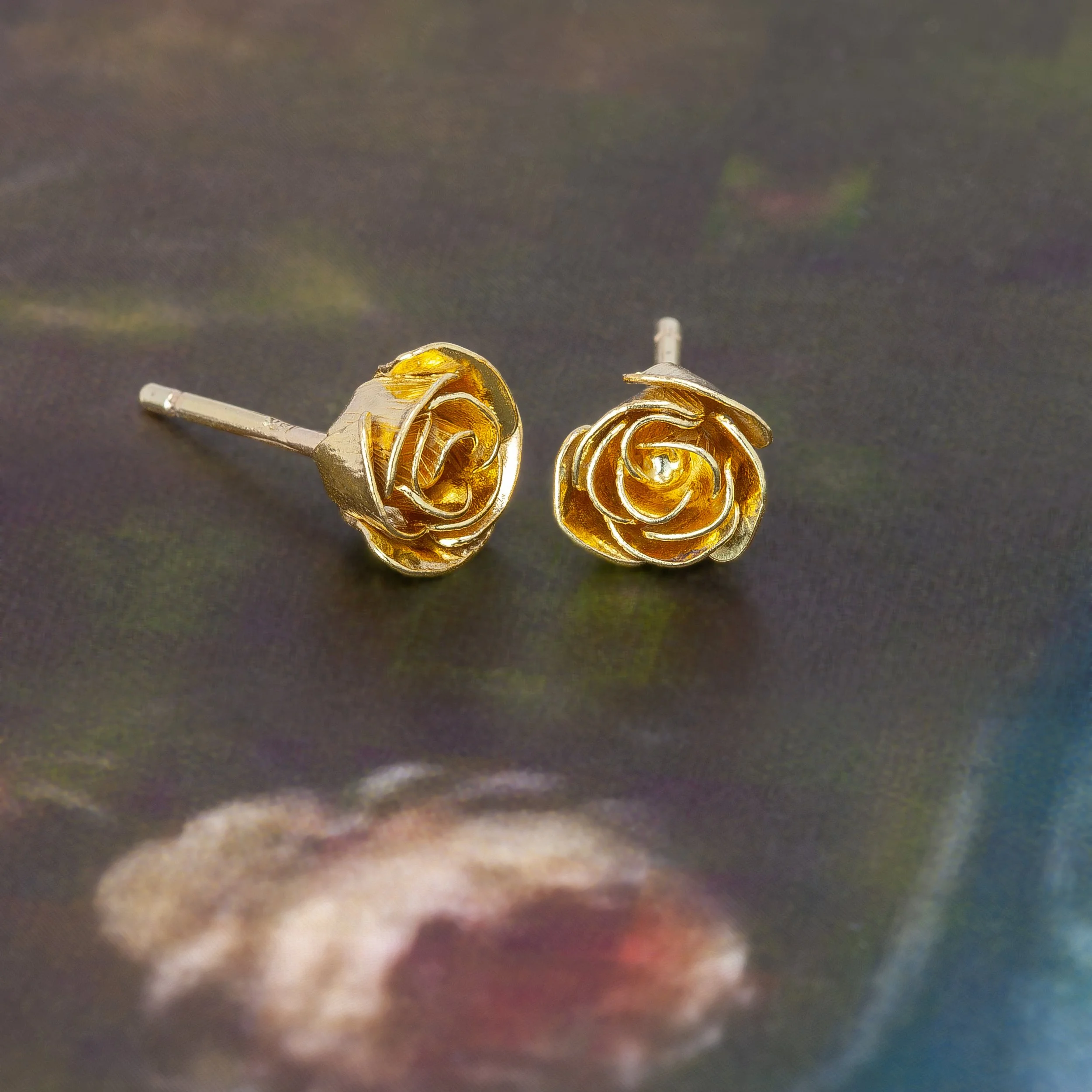 Rose studs gold on background.jpg