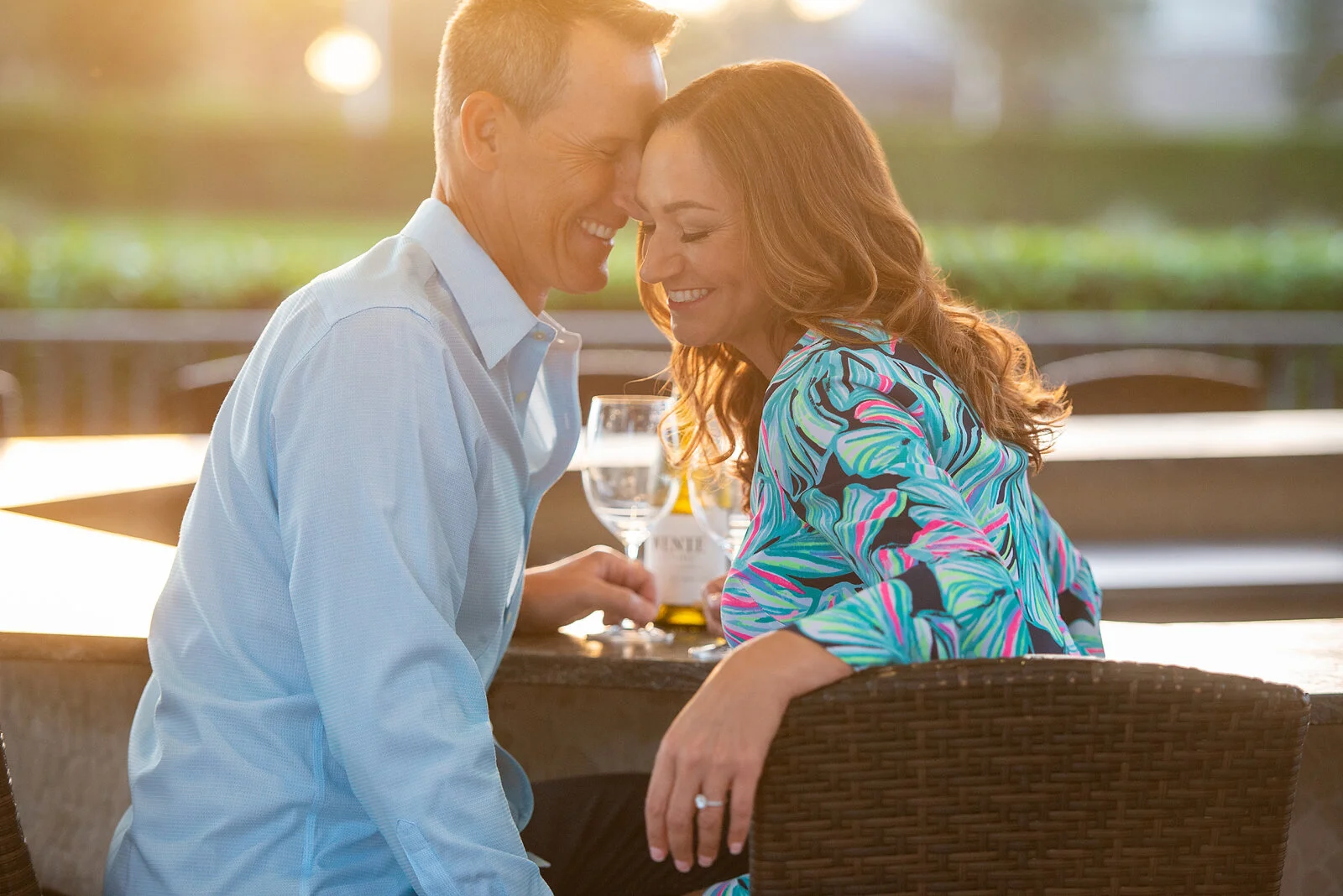 sun-flare-couple-love-laughing-sharing-wine-destination-romance.jpg