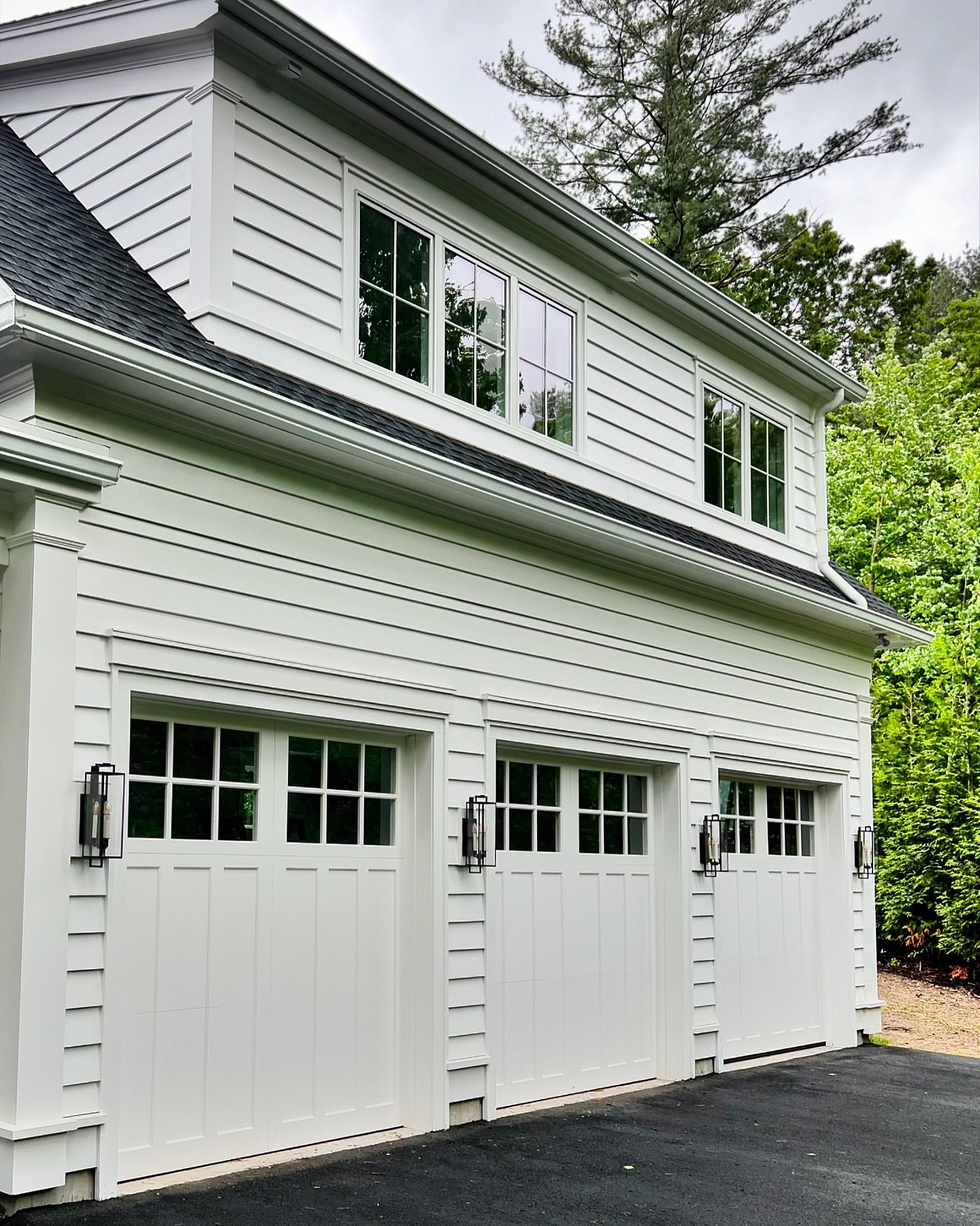 Sometimes you just need to keep it simple and classic&hellip; I love these three 9x9, 3 section Versatex doors. ⁣
On the inside is high lift track and side mount openers. ⁣
⁣
⁣
#designergaragedoors #designerdoor #customgaragedoors #carriagehousedoor 