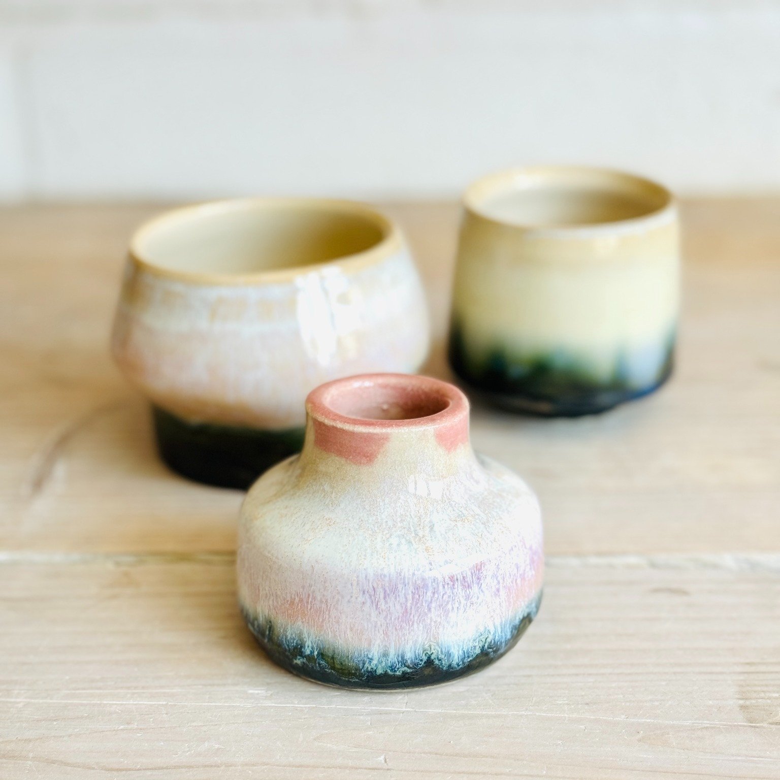 Have you ever heard of reactive glazes? If not, here's a little pottery fact to spike your curiosity. 

Reactive glaze is a single glaze that creates a spectrum of tones, adding depth.  Such glazes are composed of different raw materials, some of whi