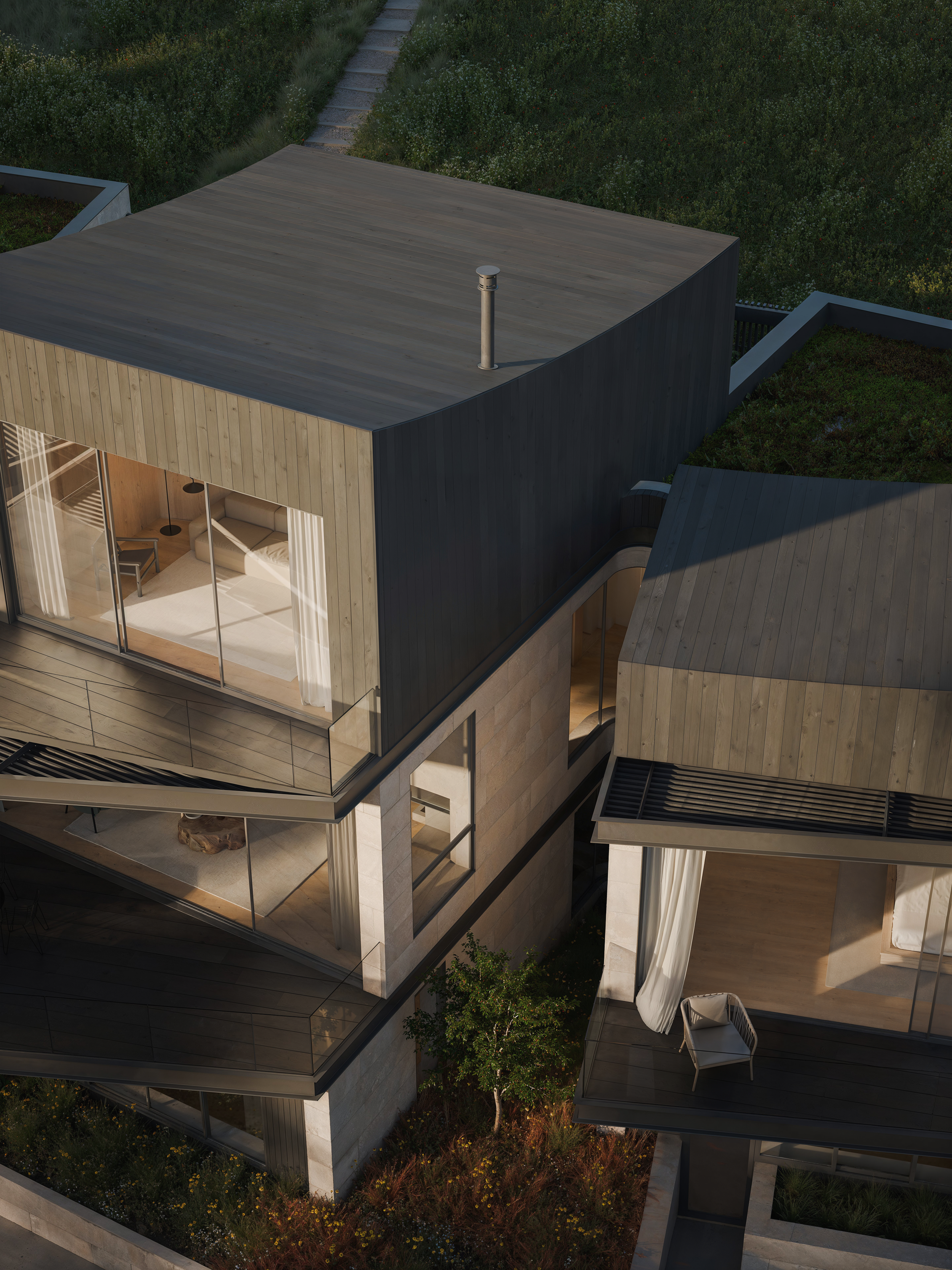 A modern multi-story house with large glass windows, wooden and concrete exterior, and a rooftop deck with a chair and curtains. The house is surrounded by greenery and landscaped garden areas.