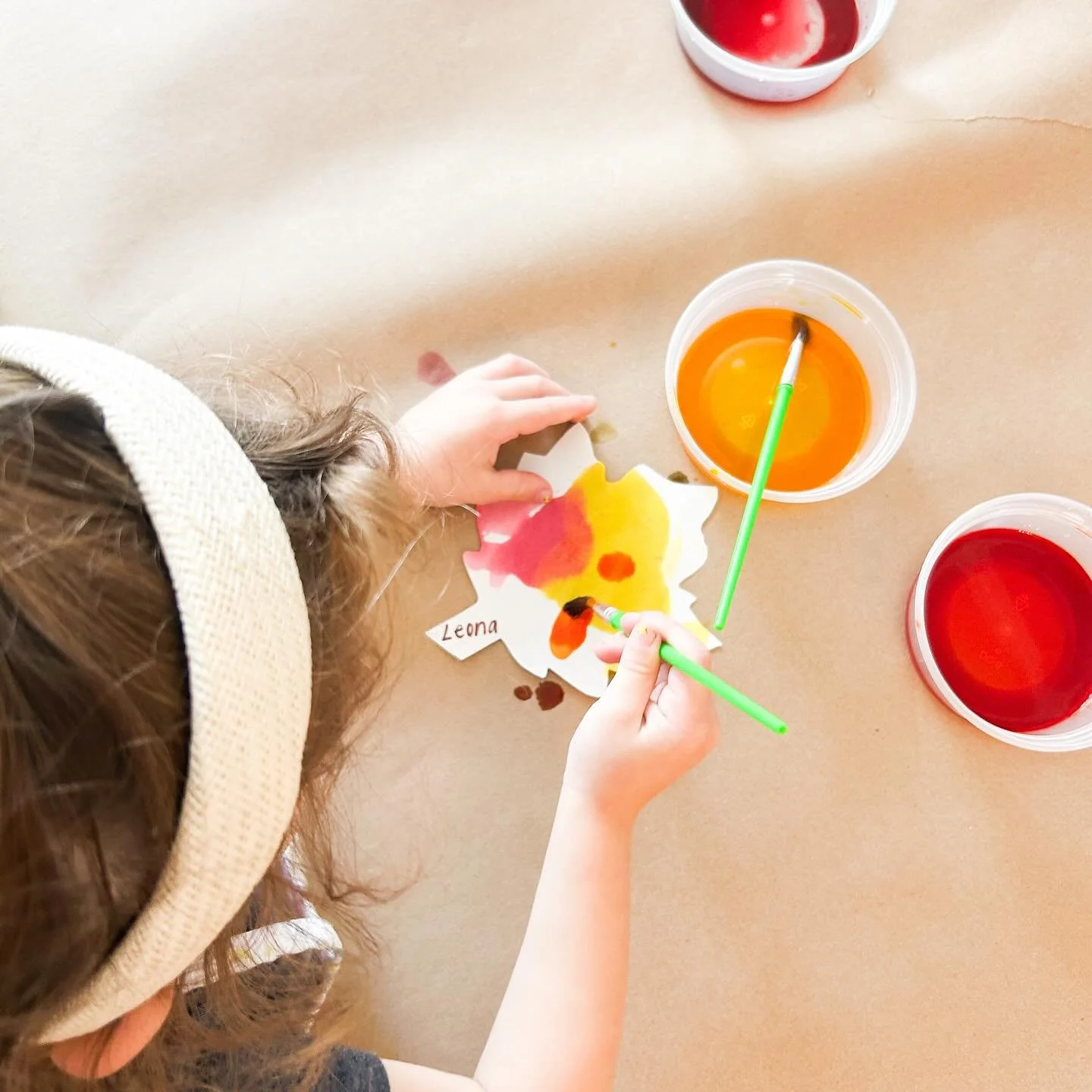 Exploring fall through art! 🍂 Our Circle Time friends painted watercolor leaves while learning about the colors and changes of the season. 🍁🧡