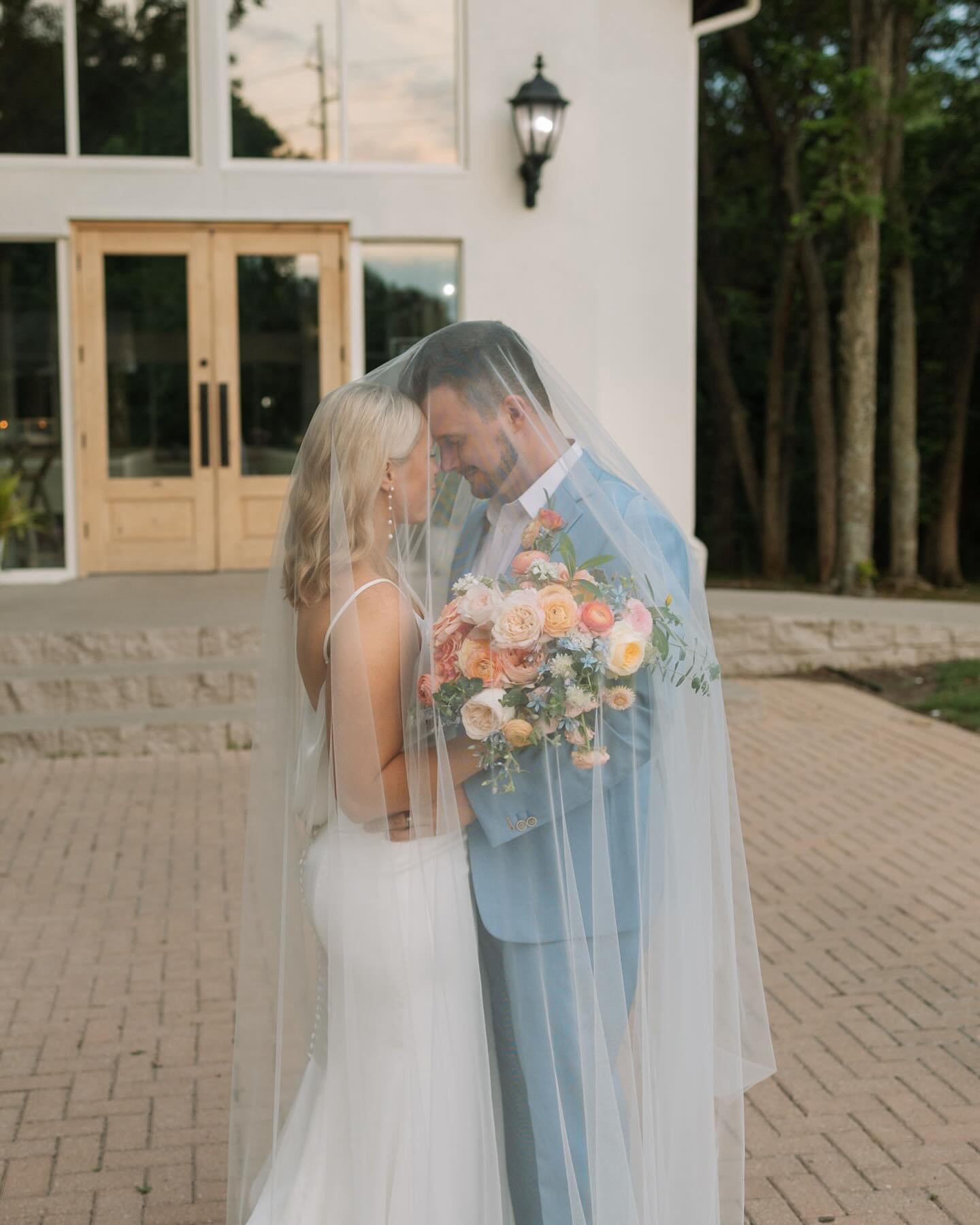 Madi + Andrew adding some sweet love to your daily Instagram scroll 🤙🏼 

But for real, is this picture not taking the term &ldquo;dreamy&rdquo; to a whole new level?! The veil, the colorful bouquet, the baby blue suit, and a gorgeous couple that&rs