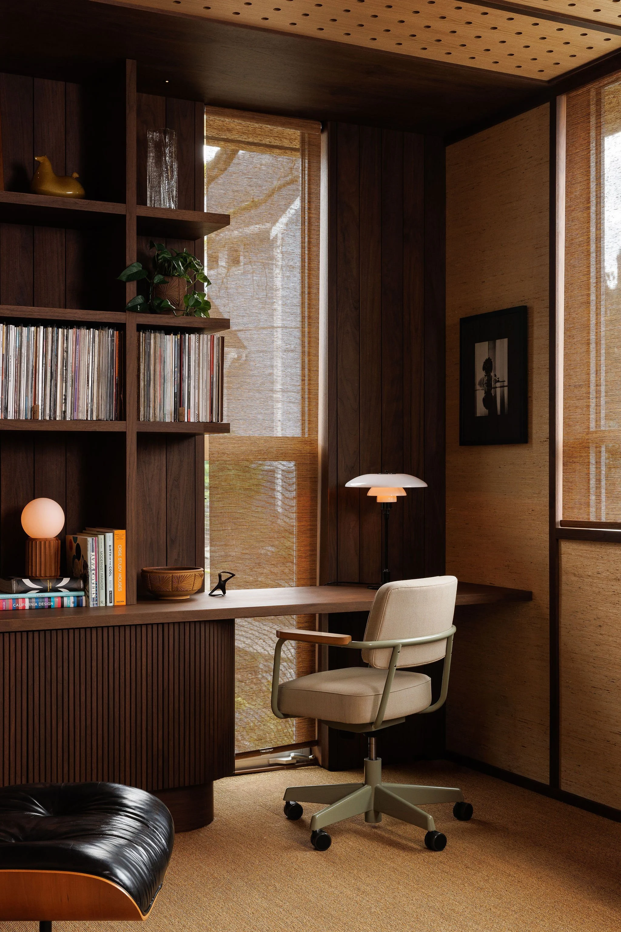 Residential listening lounge with custom walnut millwork and integrated vinyl record storage in Victoria BC by Little Giant