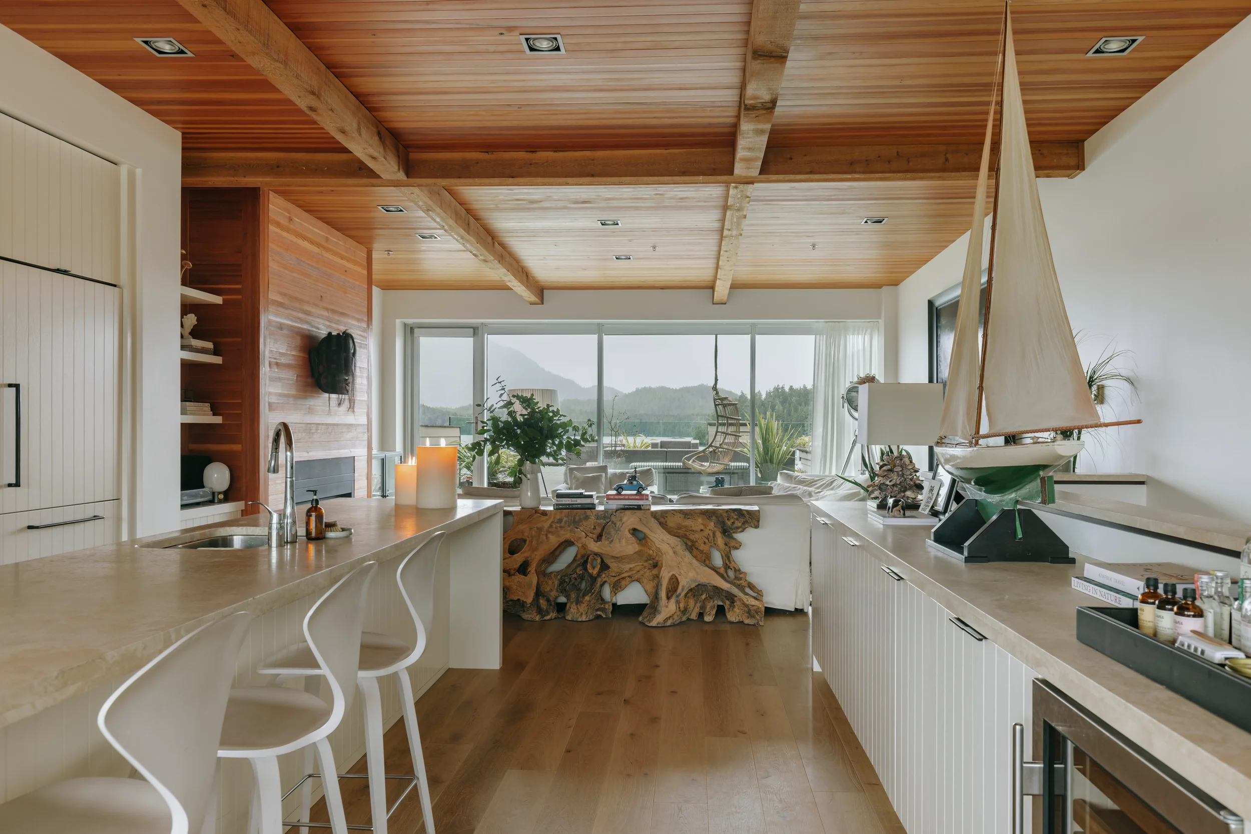 Coastal residence with exposed wood beam ceiling in Tofino, British Columbia by Little Giant