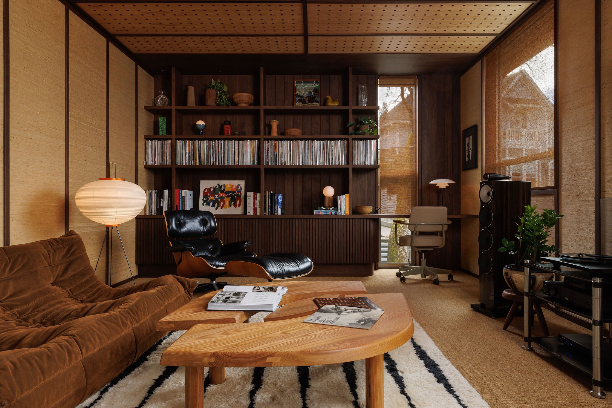 Residential listening lounge with custom walnut millwork and integrated vinyl record storage in Victoria BC by Little Giant