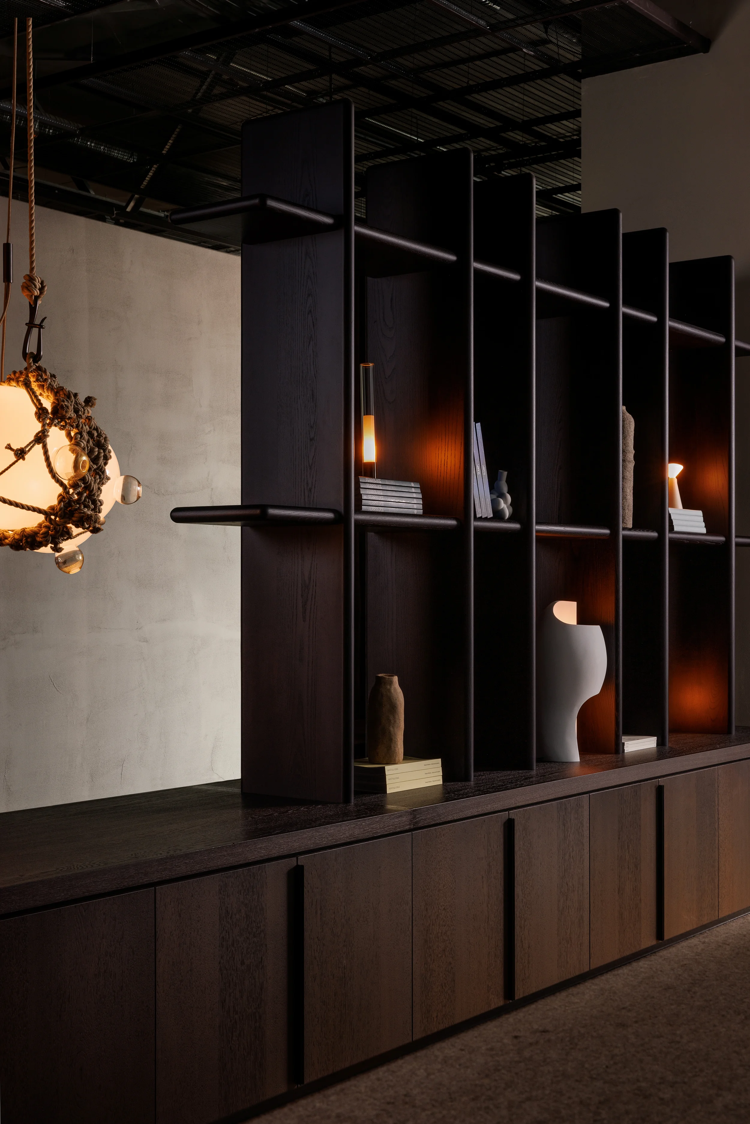 LightForm showroom with decorative table lighting and dark wood millwork in Vancouver BC by Little Giant