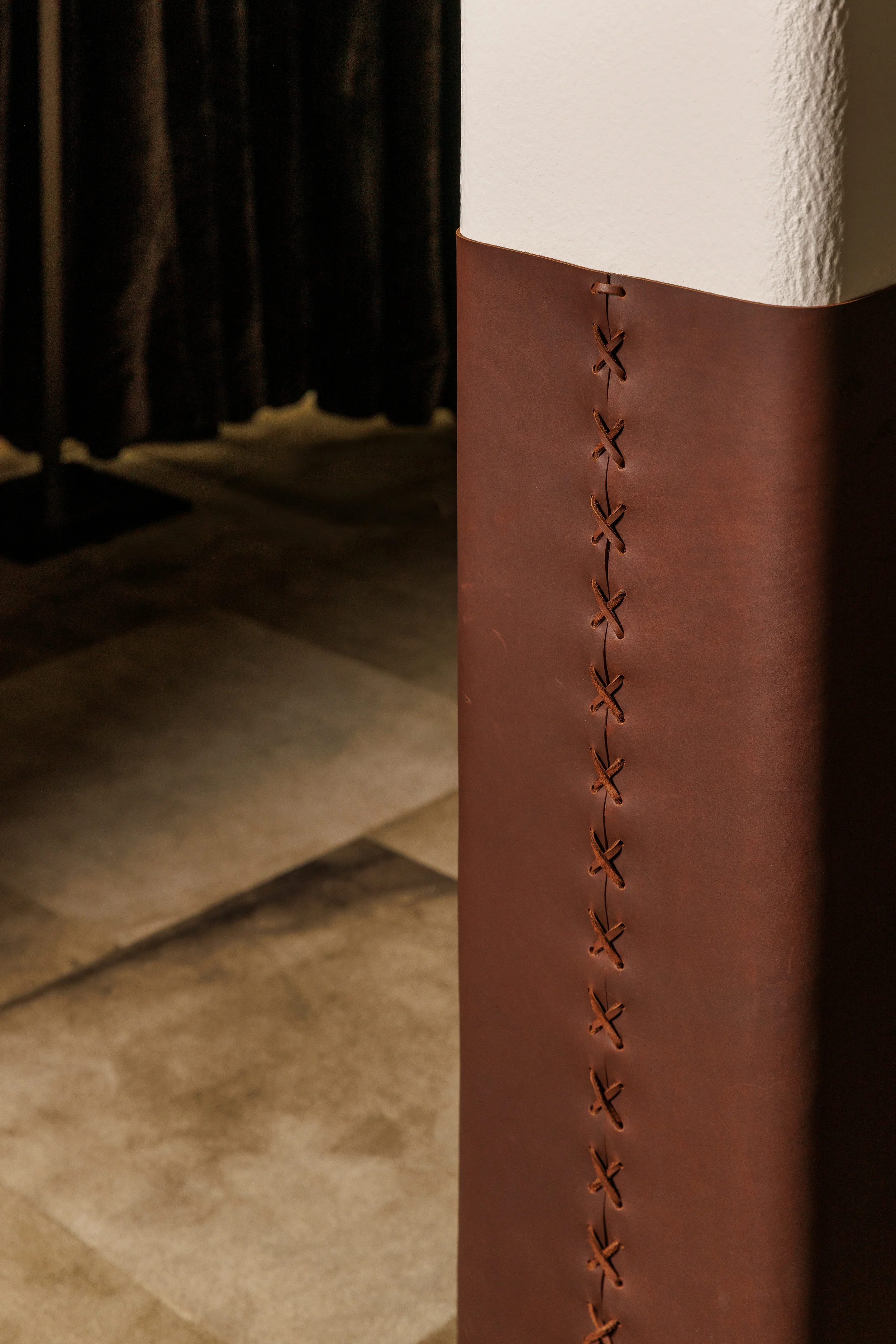 LightForm showroom detail featuring leather-wrapped architectural elements in Vancouver BC by Little Giant
