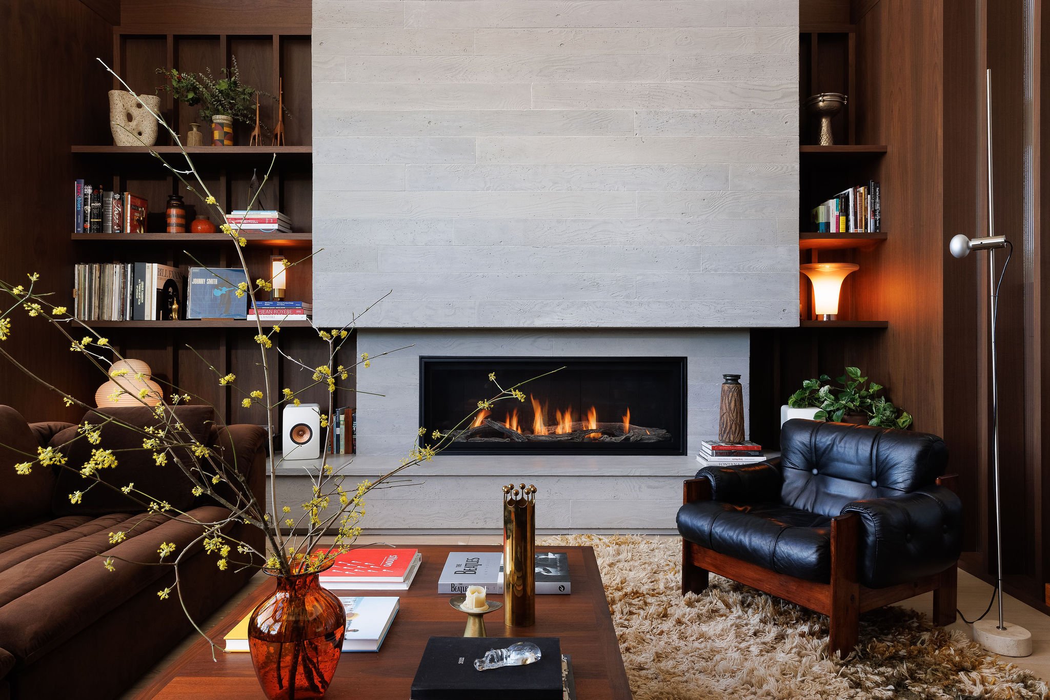 Contemporary residential living room featuring a statement fireplace in Victoria BC by Little Giant