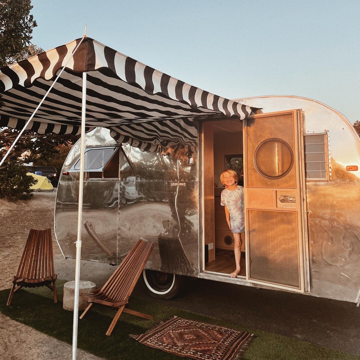 First night camping in our fully restored vintage VAKASHUNETTE 🤍 We love her!! This trailer features a full bed in the back, running water, solar power, two burner stove, fridge with small freezer area, fold up table, pull out coach in front (that s