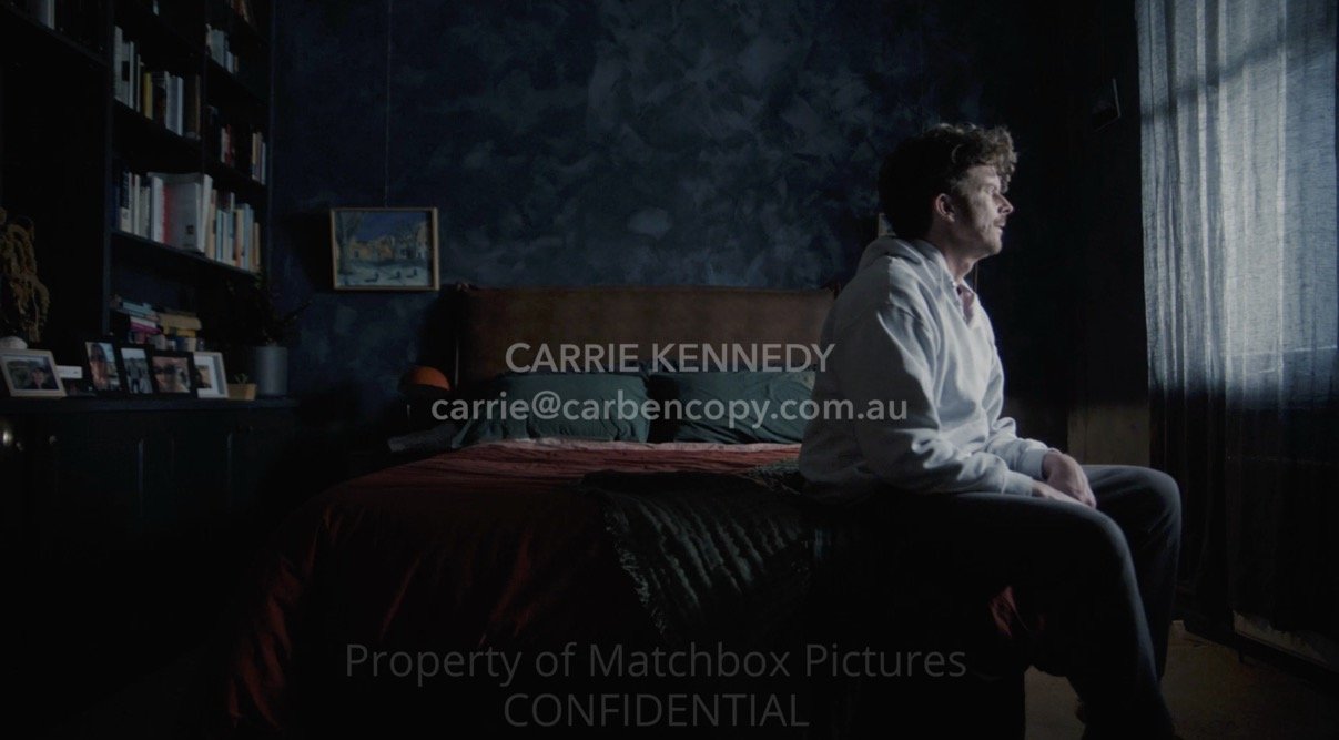 Roland sits on the bed.jpg