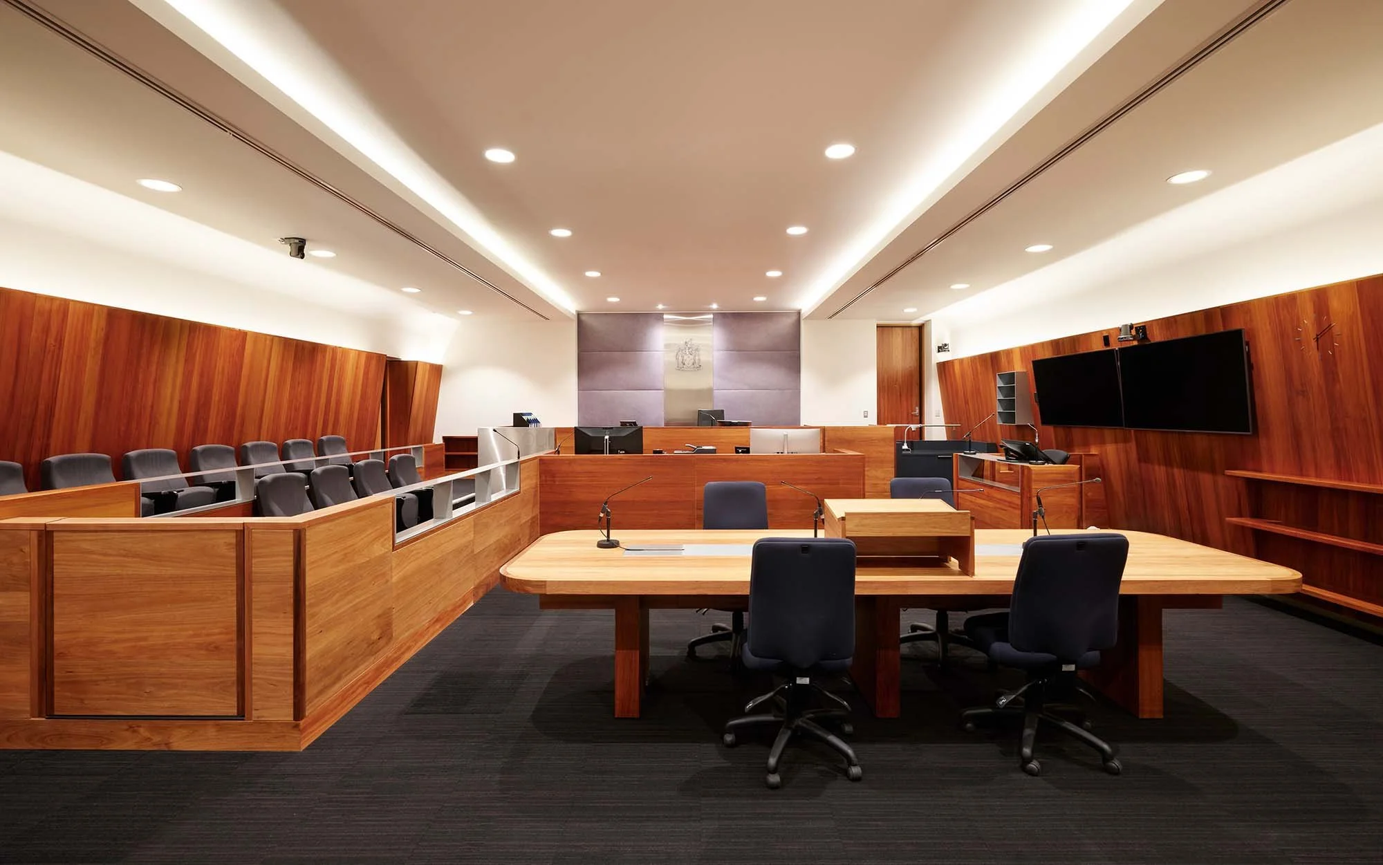 Trial courtroom with jury box, timber panelling and bar table seating