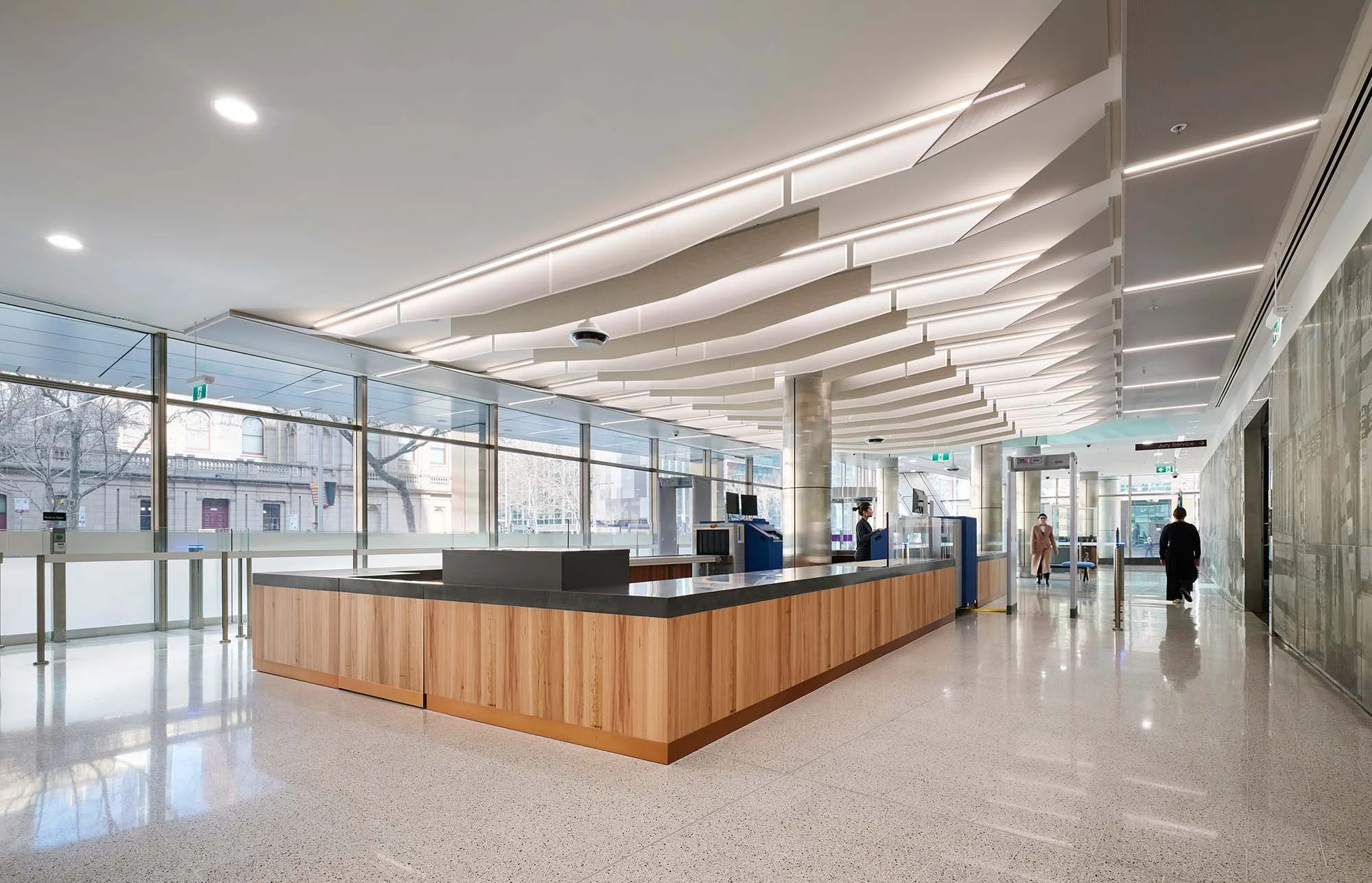 Court security desk with view of heritage building through glazed facade