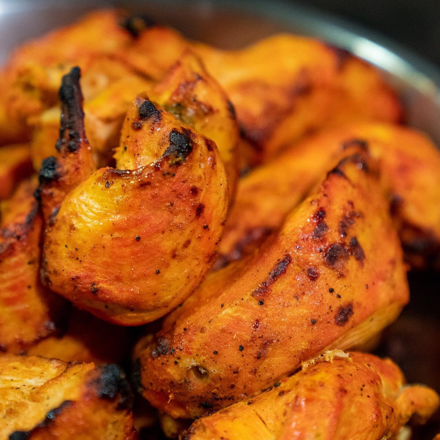 Tandoori Chicken served on a sizzling platter ❤️🔥 Chicken cooked in our traditional Tandoor with onions, bell peppers and lemon. 😍 Available at all 3 locations for patio dining or takeout! 😁 Tandoori specials, vegetarian specials, biryani dishes, 