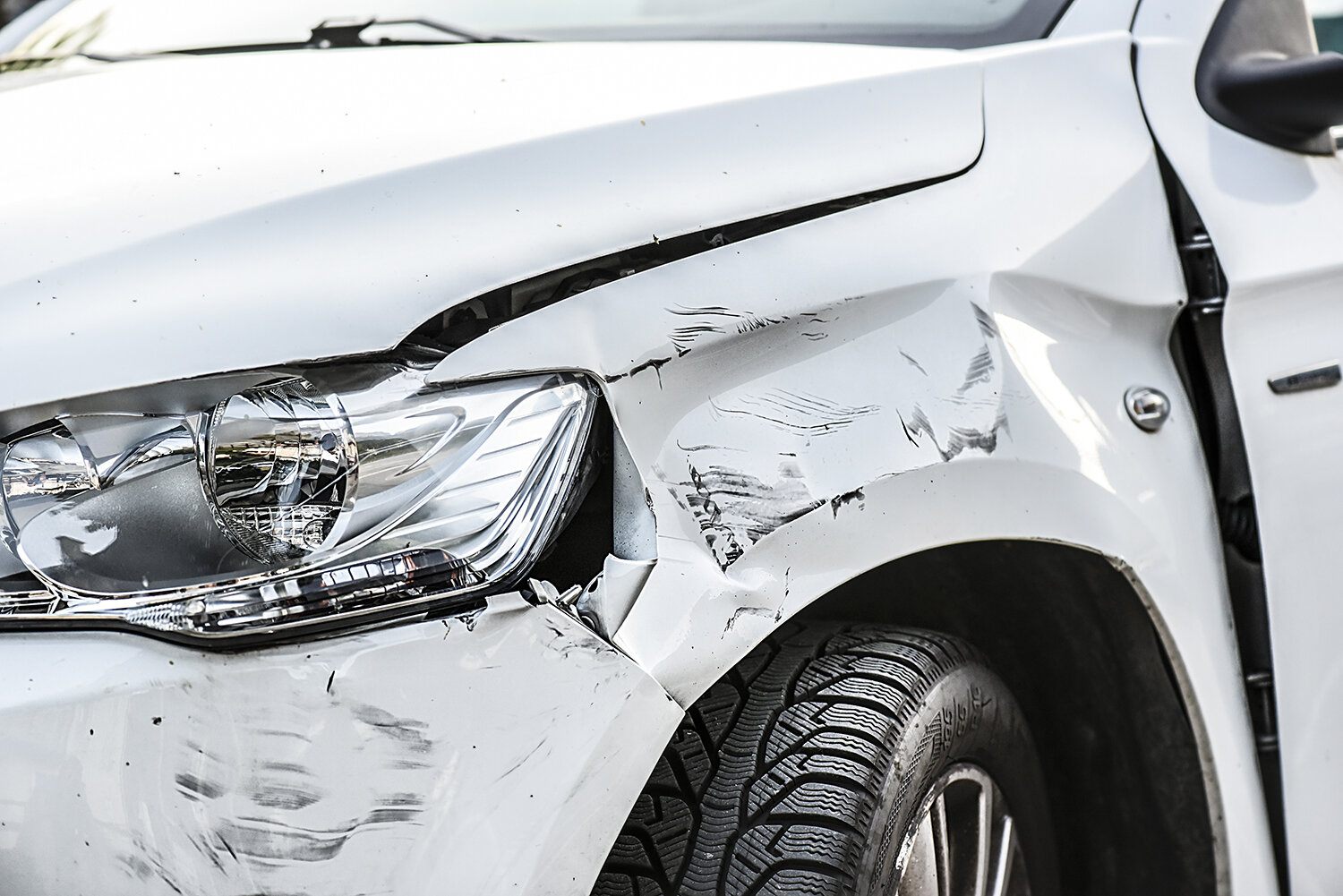 Many broken cars after a traffic accident in the parking lot of a