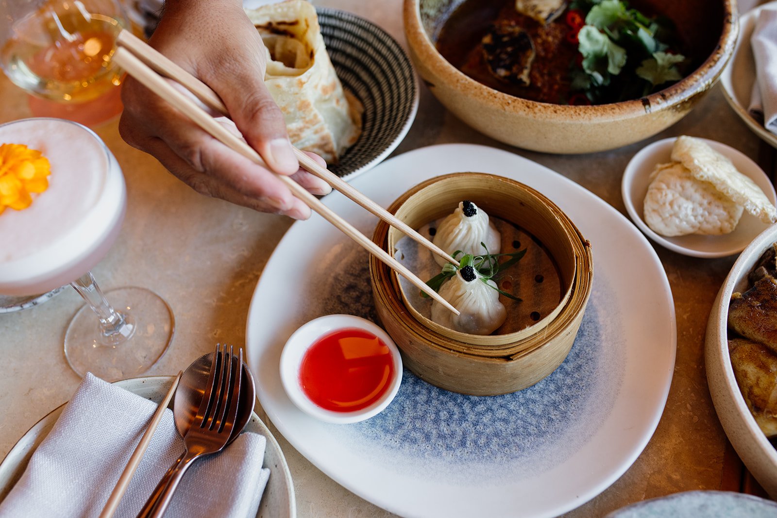Gold Coast restaurant photographer captures table of meals at Gold Coast lifestyle restaurant shoot.