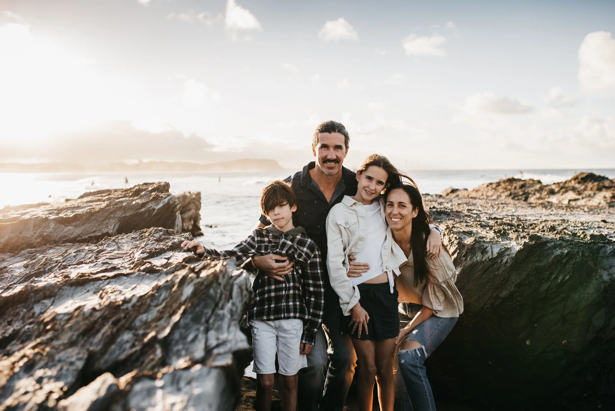 Family portrait by Gold Coast family photographer at Currumbin beach.