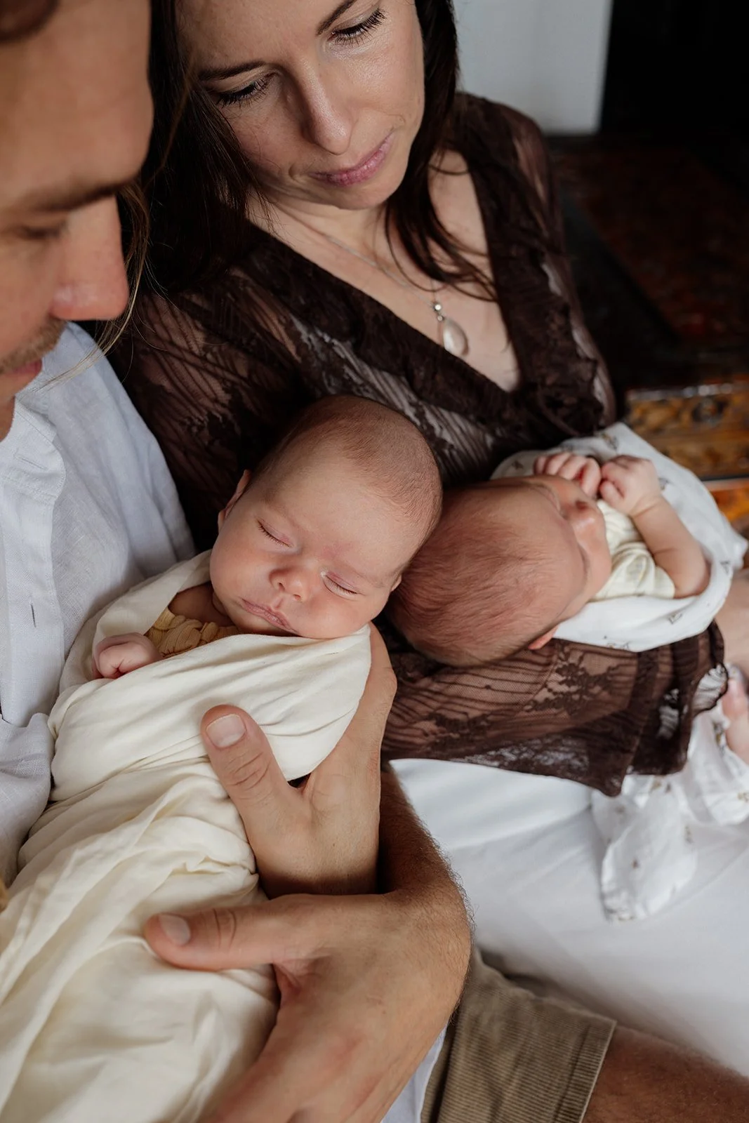 Gold Coast newborn photographer captures babies at home with parents during Gold Coast twins newborn session.