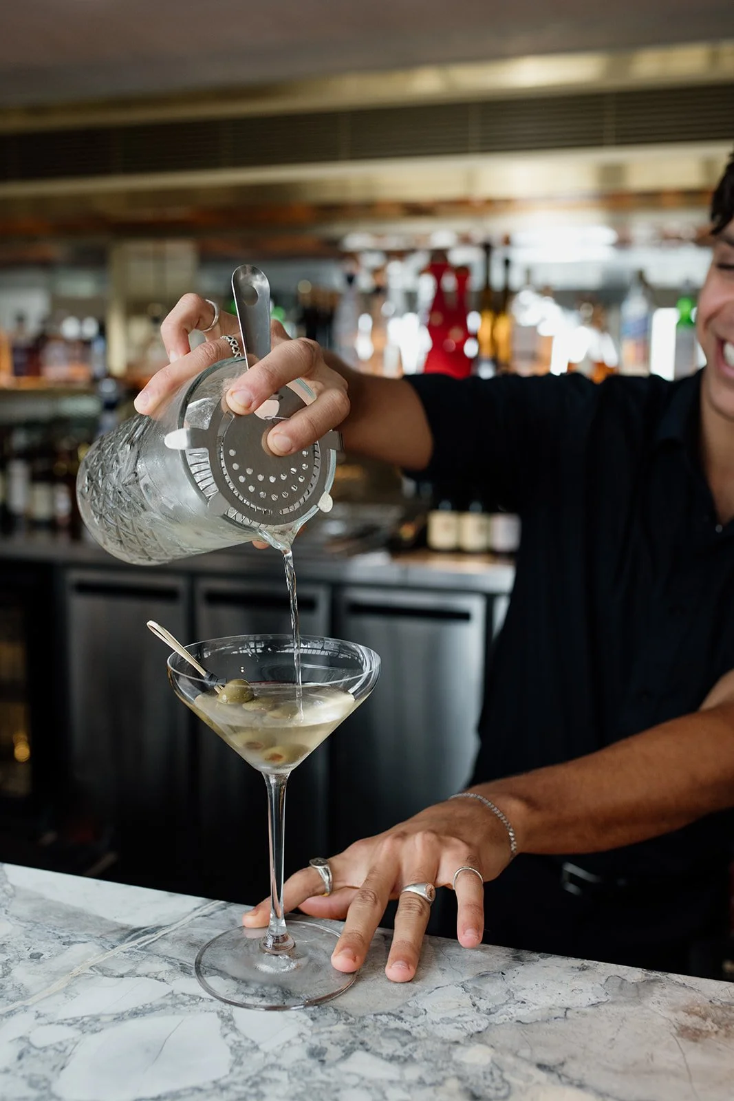 Gold Coast restaurant photographer captures bartender making a drink during Gold Coast restaurant photography shoot. 