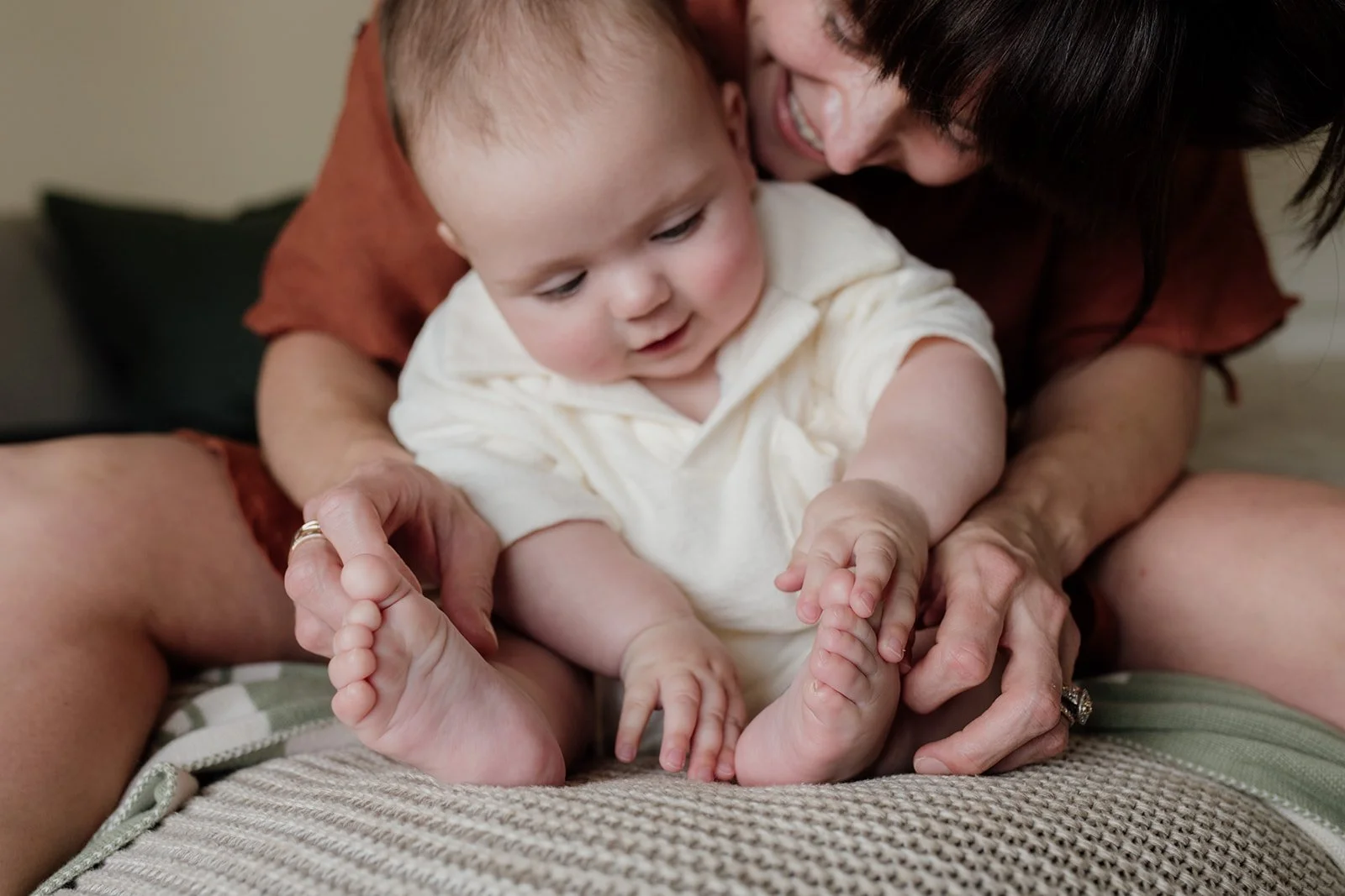 Tweed Coast family photography session with older baby and mother on the bed.