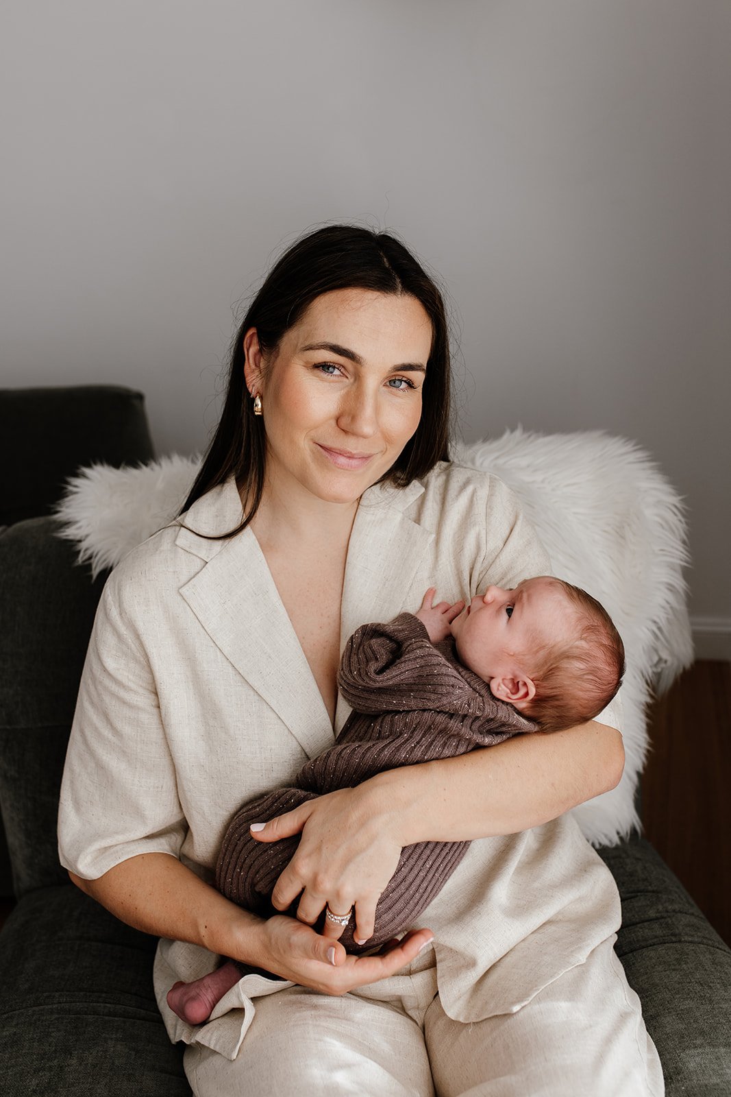 Tweed Coast newborn photo shoot captures mother and baby at home.