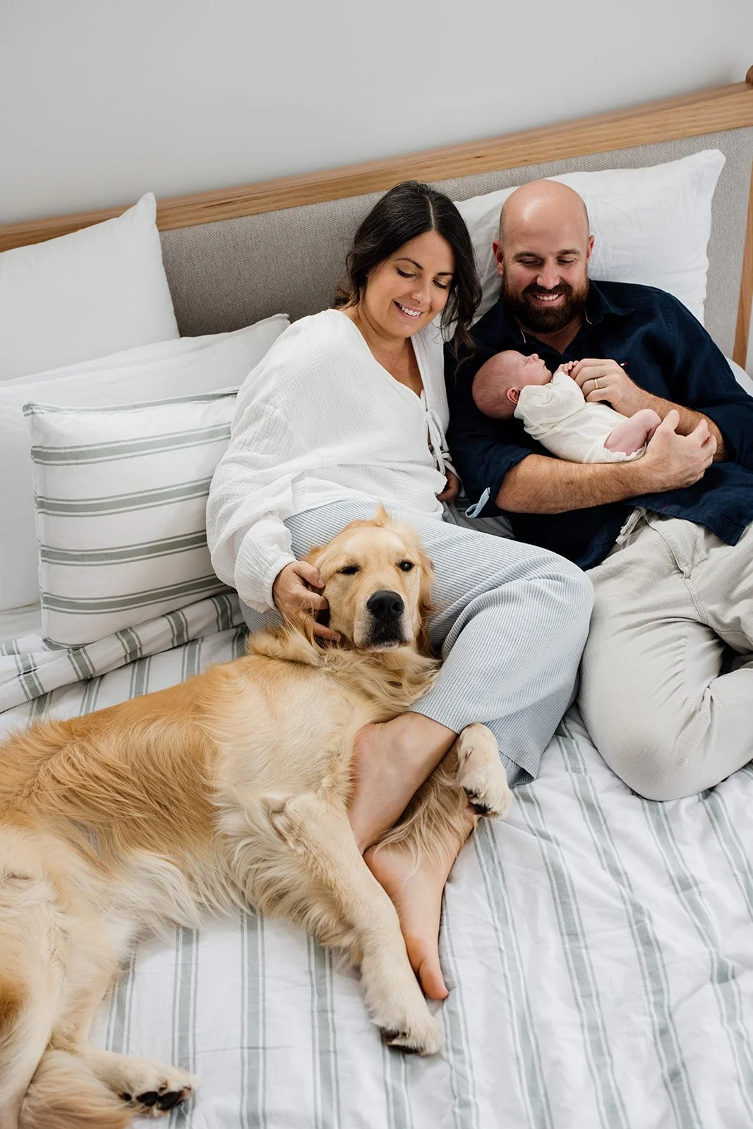 Tweed Coast newborn photo shoot captures parents and baby at home during Tweed Coast baby photo shoot.