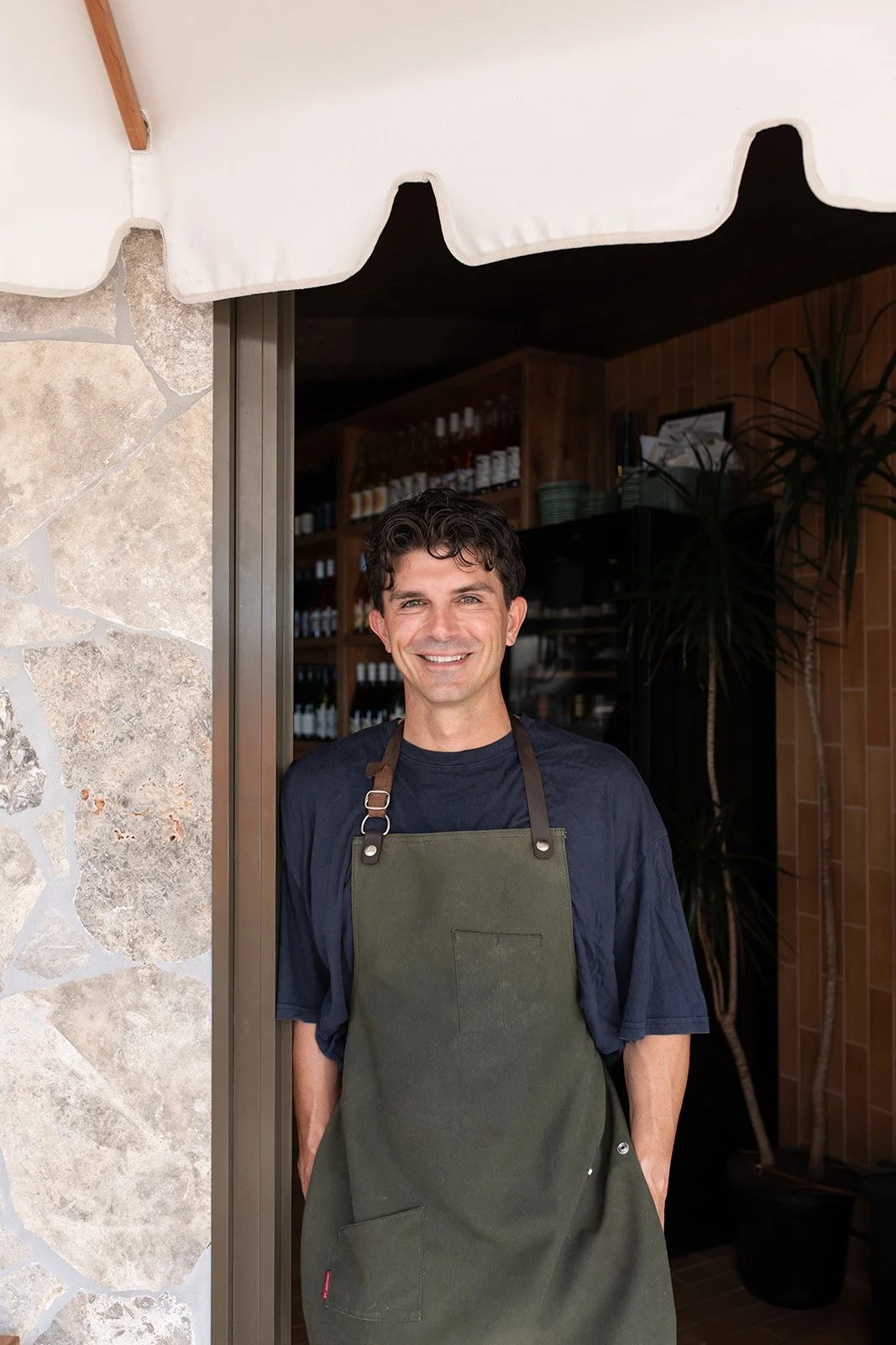 Gold Coast lifestyle photographer captures business owner at front of restaurant during Gold Coast lifestyle photography session.