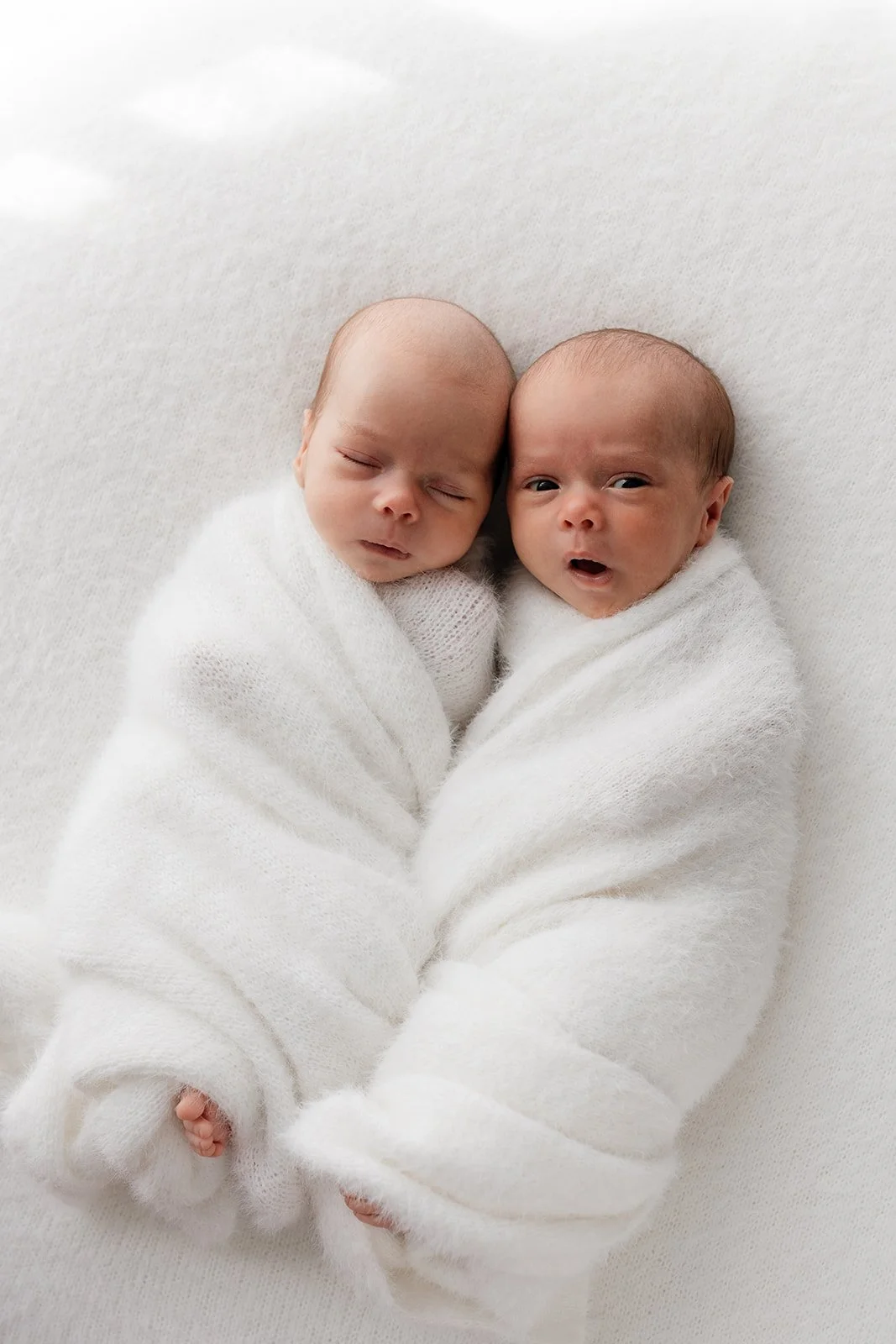 Gold Coast newborn photographer captures babies at home on beanbag during Gold Coast twins newborn session.