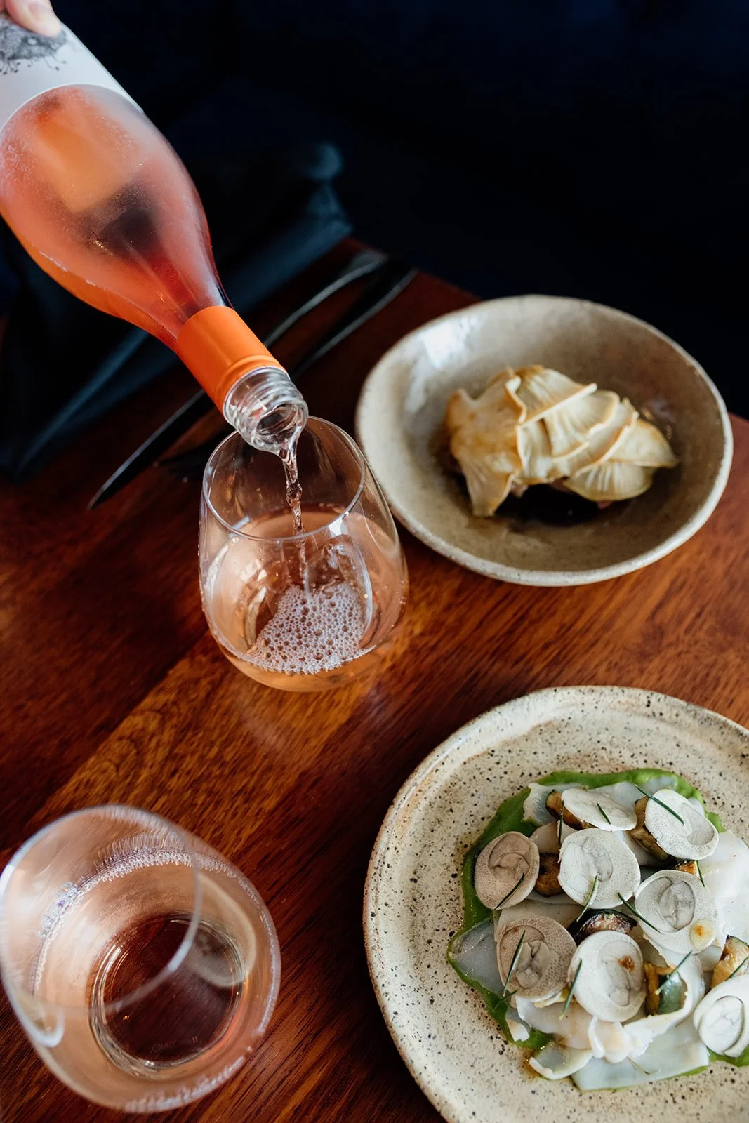 Gold Coast commercial photography captures restaurant setting with wine during Gold Coast commercial photography session.