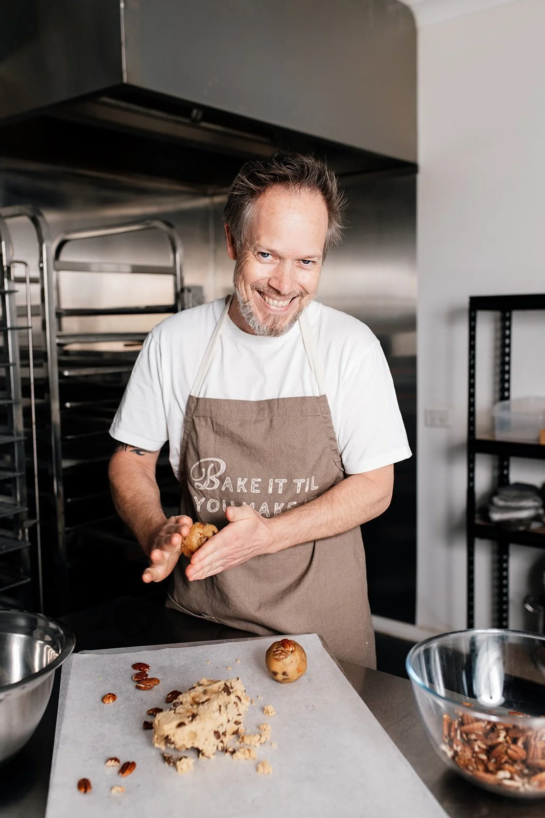 Gold Coast business photographer captures male baker in kitchen during Gold Coast business branding photography session.