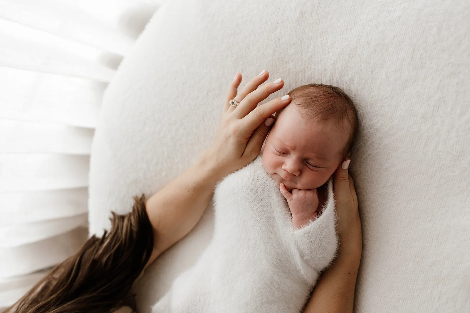 Tweed Coast newborn photographer captures baby on beanbag with mother during Tweed Heads newborn photography session.