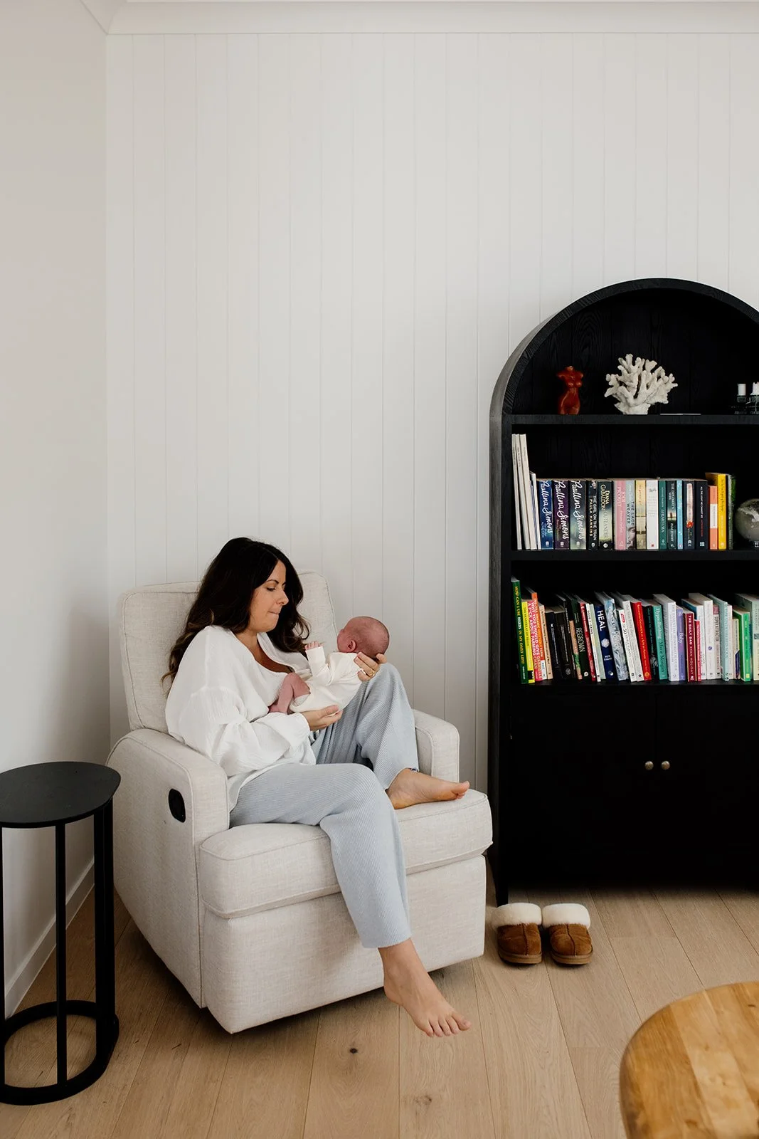 Tweed Coast newborn photo shoot captures mother and baby at home.