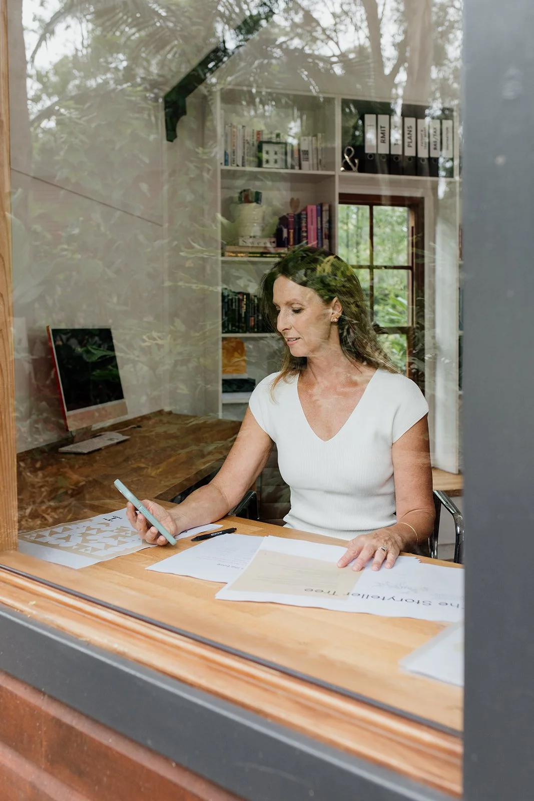 Personal branding photo shoot on the Gold Coast captures business owner in her home office studio.
