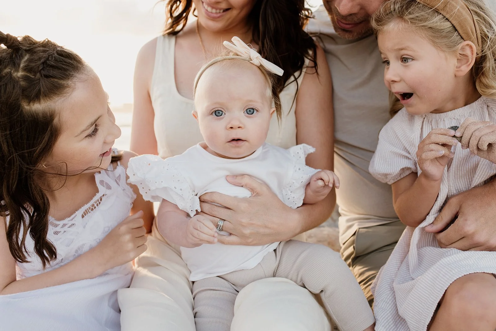 Gold Coast photographer with young family at sunset during Gold Coast photography shoot.