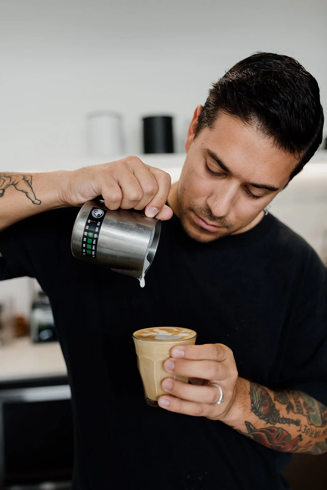 Gold Coast cafe photography with barista in action by Gold Coast cafe photographer.