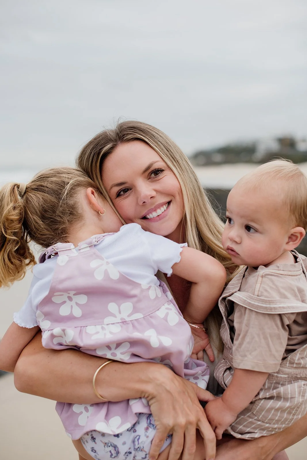 Gold Coast family photographer with mother and children at the beach during Gold Coast family photos. 