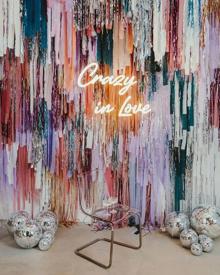 Foil Fringe Backdrop with Neon Sign.jpeg