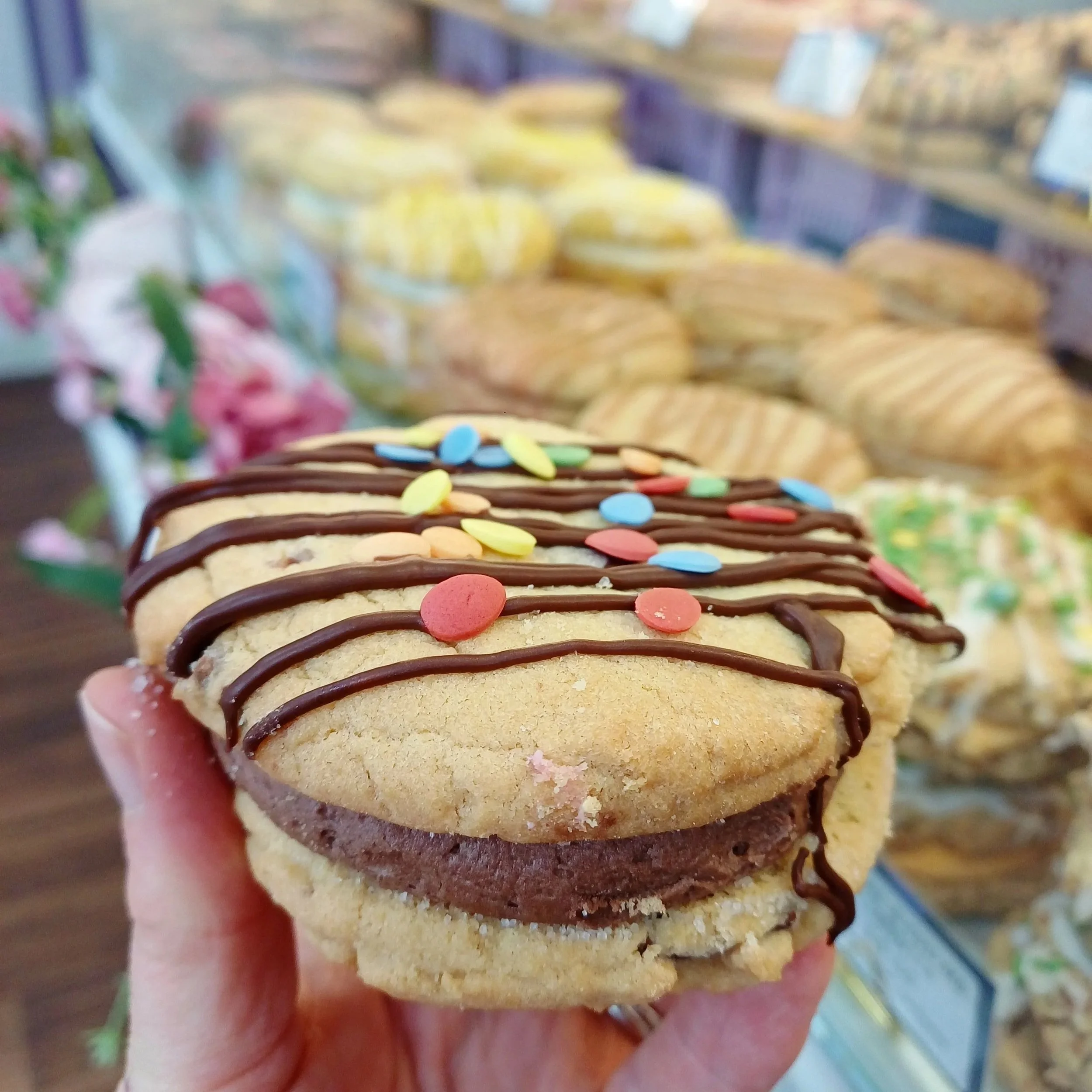 Hand holding mini egg cookie sandwich