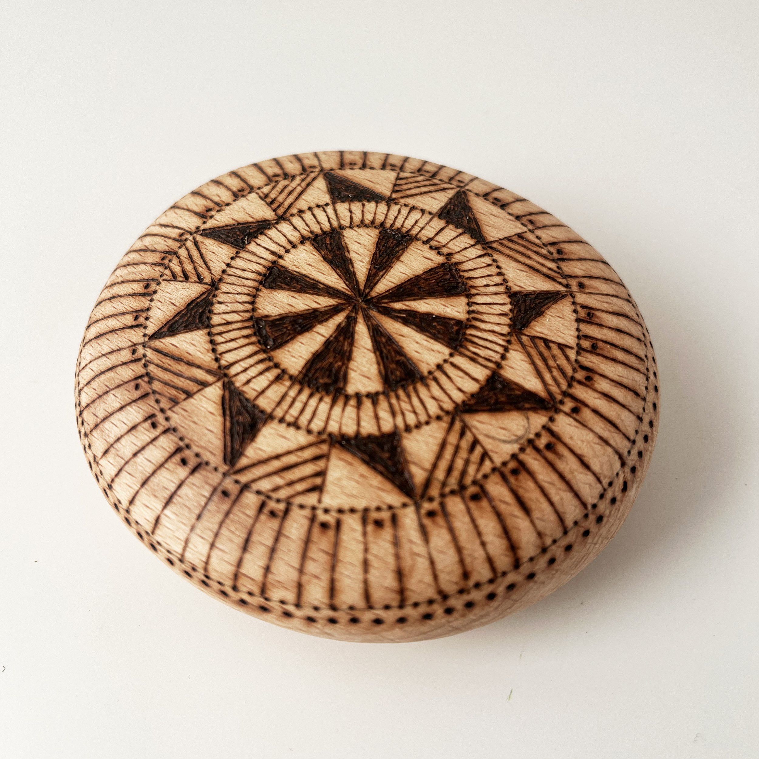 illustration-pyrographed-pebble-patterned.jpg