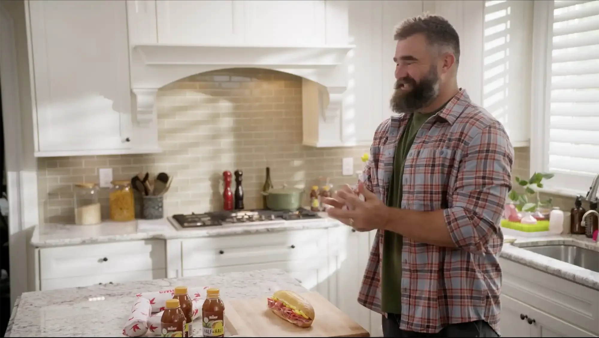 Jason Kelce Philadelphia Eagles in kitchen holding Wawa hoagie