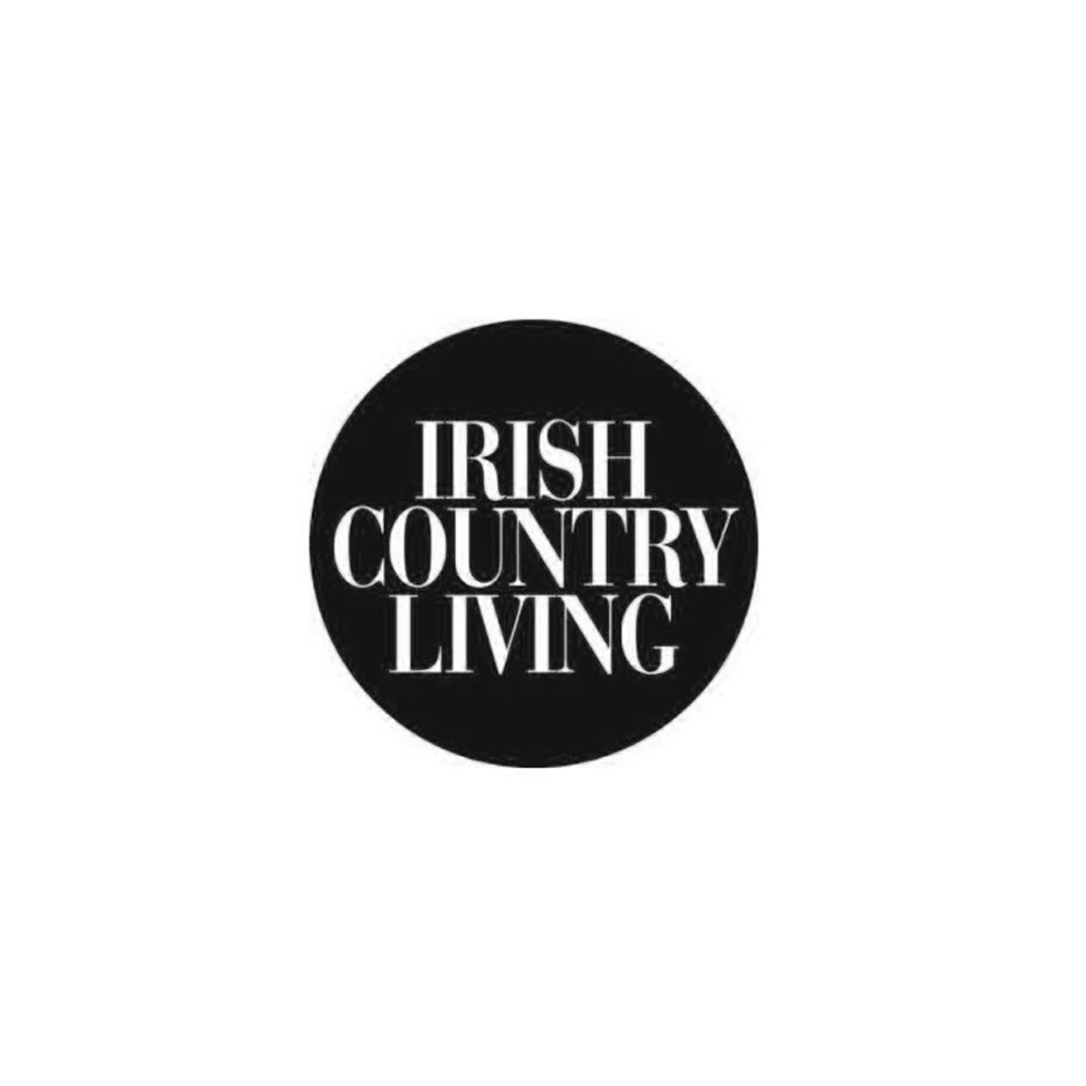 Black circular logo with white text reading "Irish Country Living" in the center.