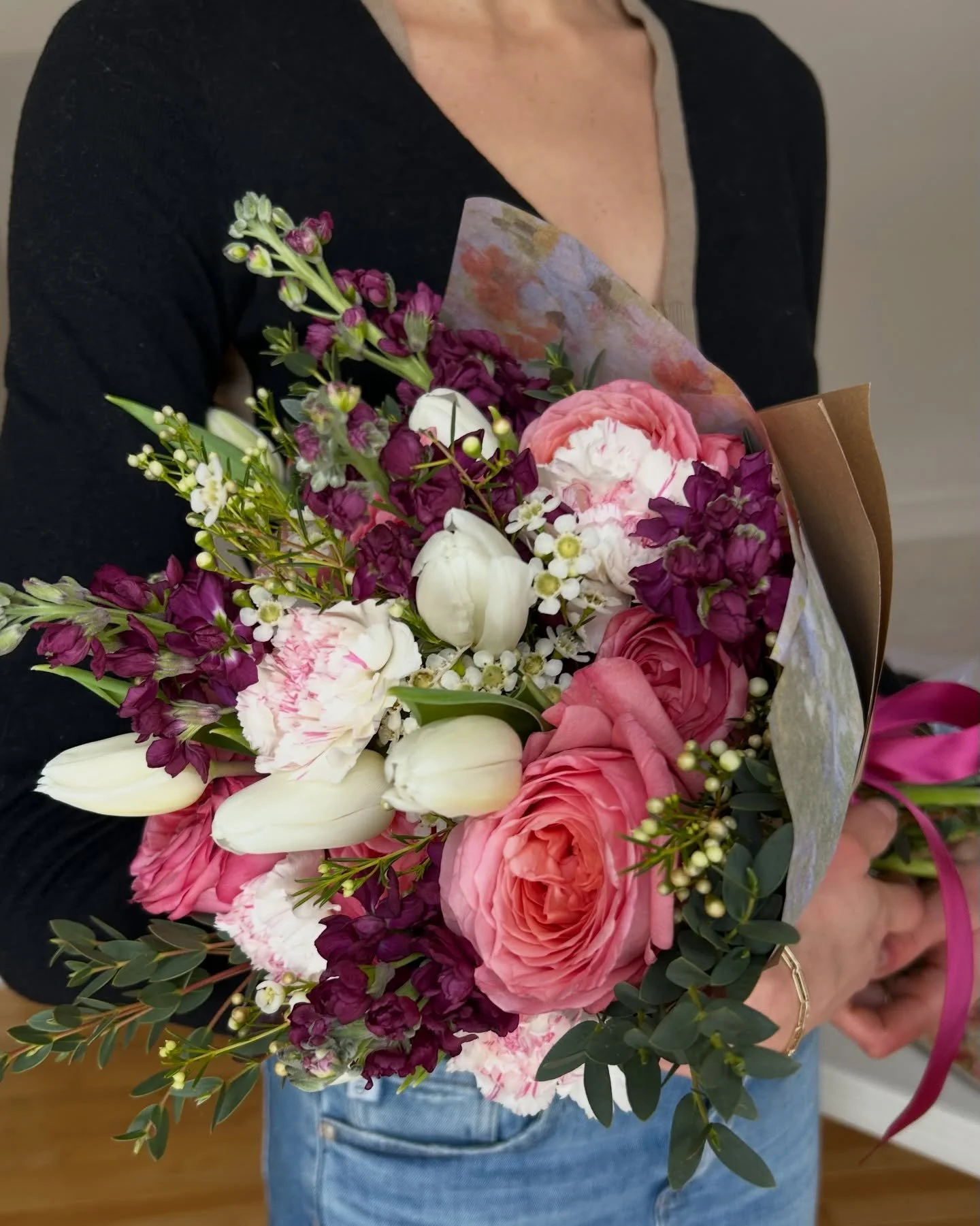 Tired of plastic-wrapped bouquets?

Ours are finished with beautiful wraps, ribbon, and small details that make each bouquet feel truly personal.

This Meadow-size bouquet pairs pink garden roses, plum stock, white tulips, white wax flower, and eucal