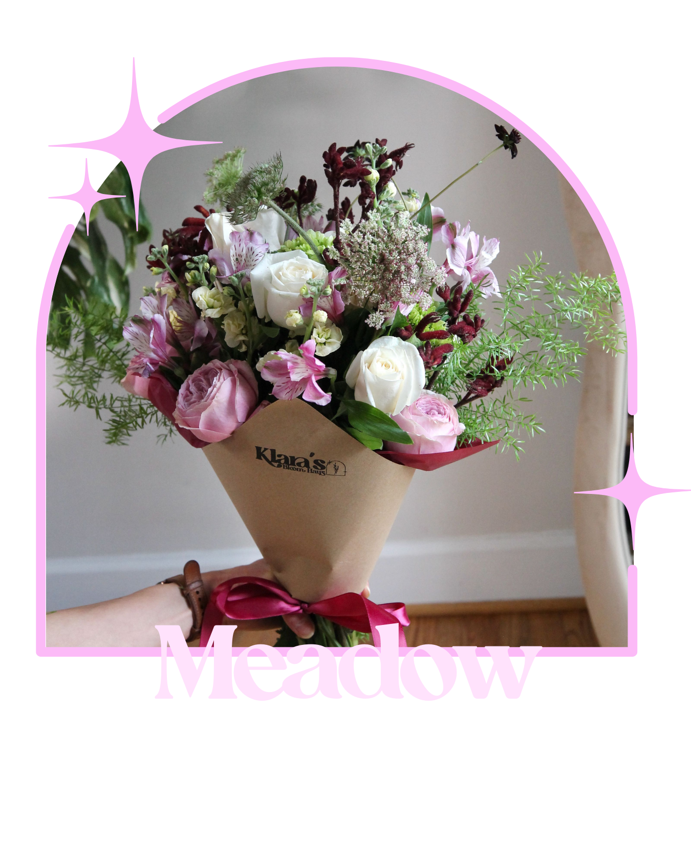 Bright spring bouquet featuring plum, coral, and pink flowers with fresh greenery wrapped in natural paper. Cheerful seasonal bouquet design by Klara’s Bloom Haus floral studio.