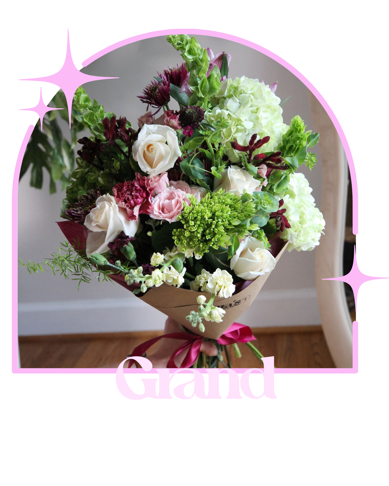 Elegant bouquet with white roses, pale blush flowers, and textured greenery arranged in modern garden style. Refined floral design created for weddings and special occasions.