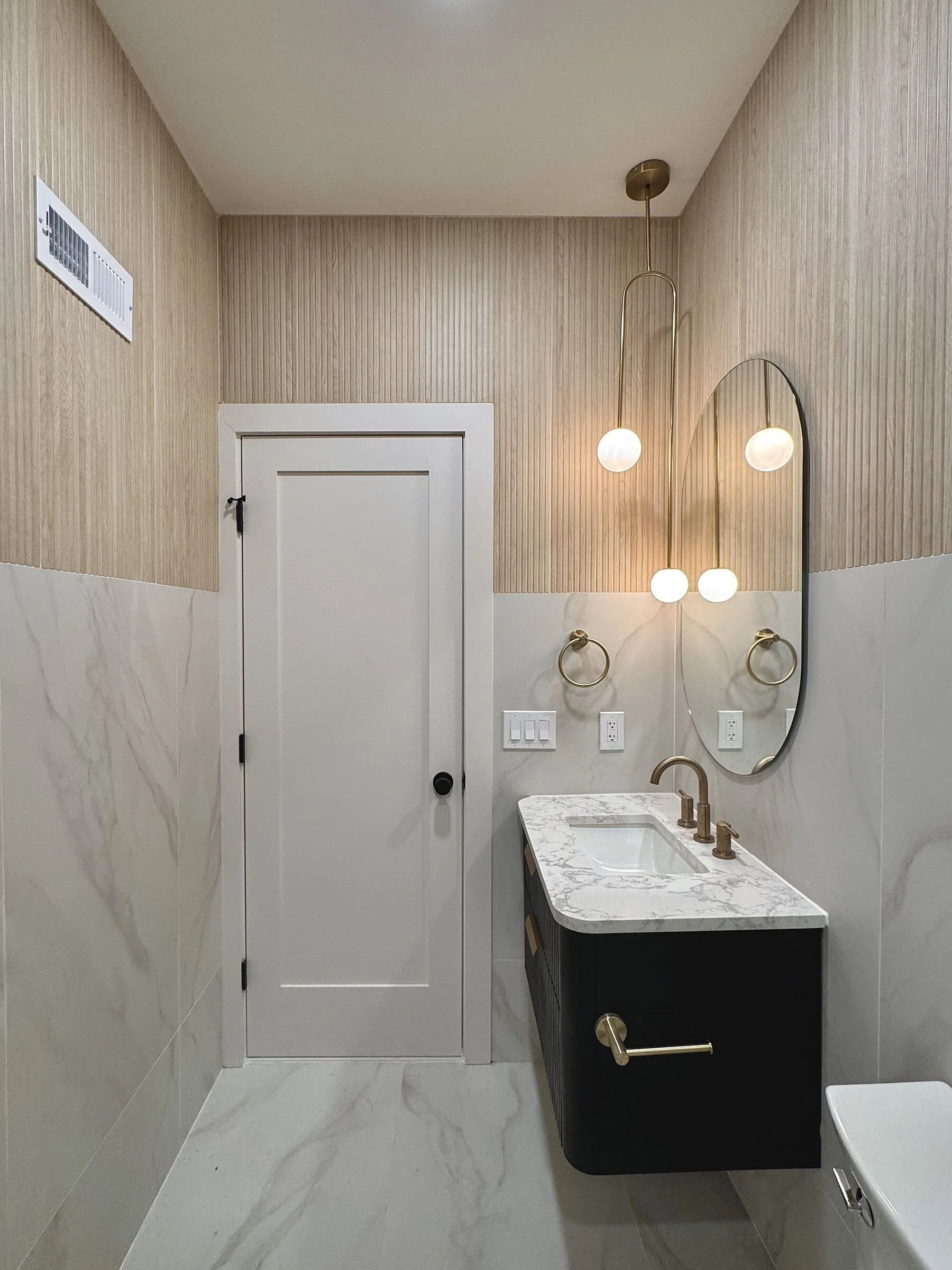 woodland-road-27-powder-room-arched-mirror.jpg