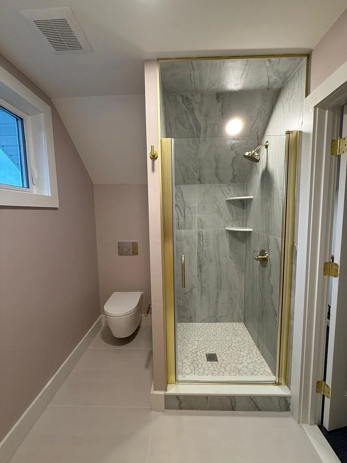 queens-court-11-attic-bath-glass-shower-brass-frame.jpg