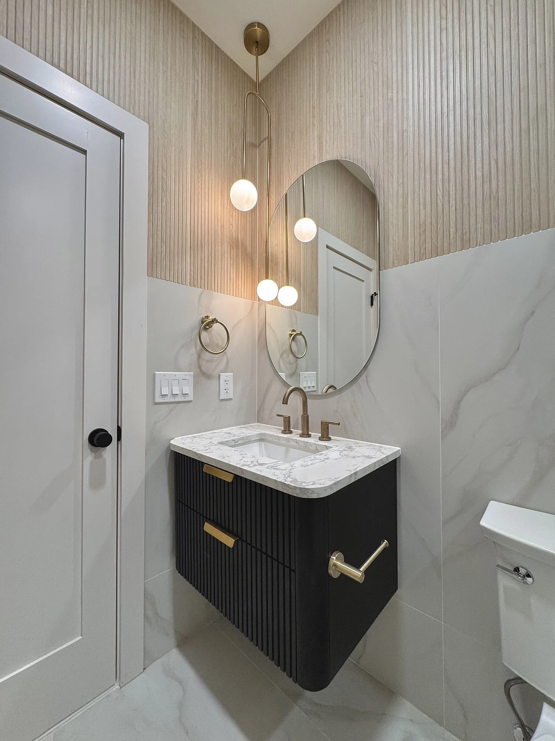 woodland-road-25-powder-room-navy-vanity-oval-mirror.jpg