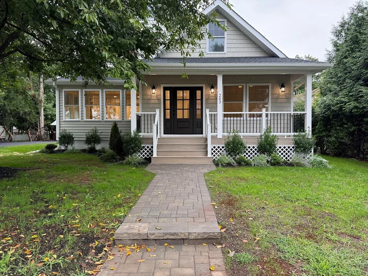 Queens Court rebuilt front porch with new columns and railings