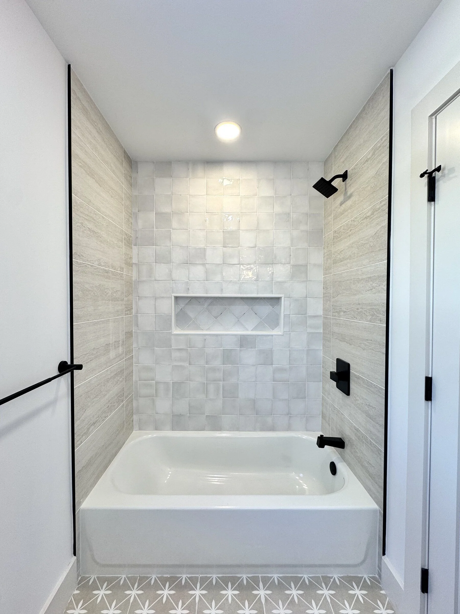 woodland-road-19-hall-bath-tub-shower-patterned-floor.jpg