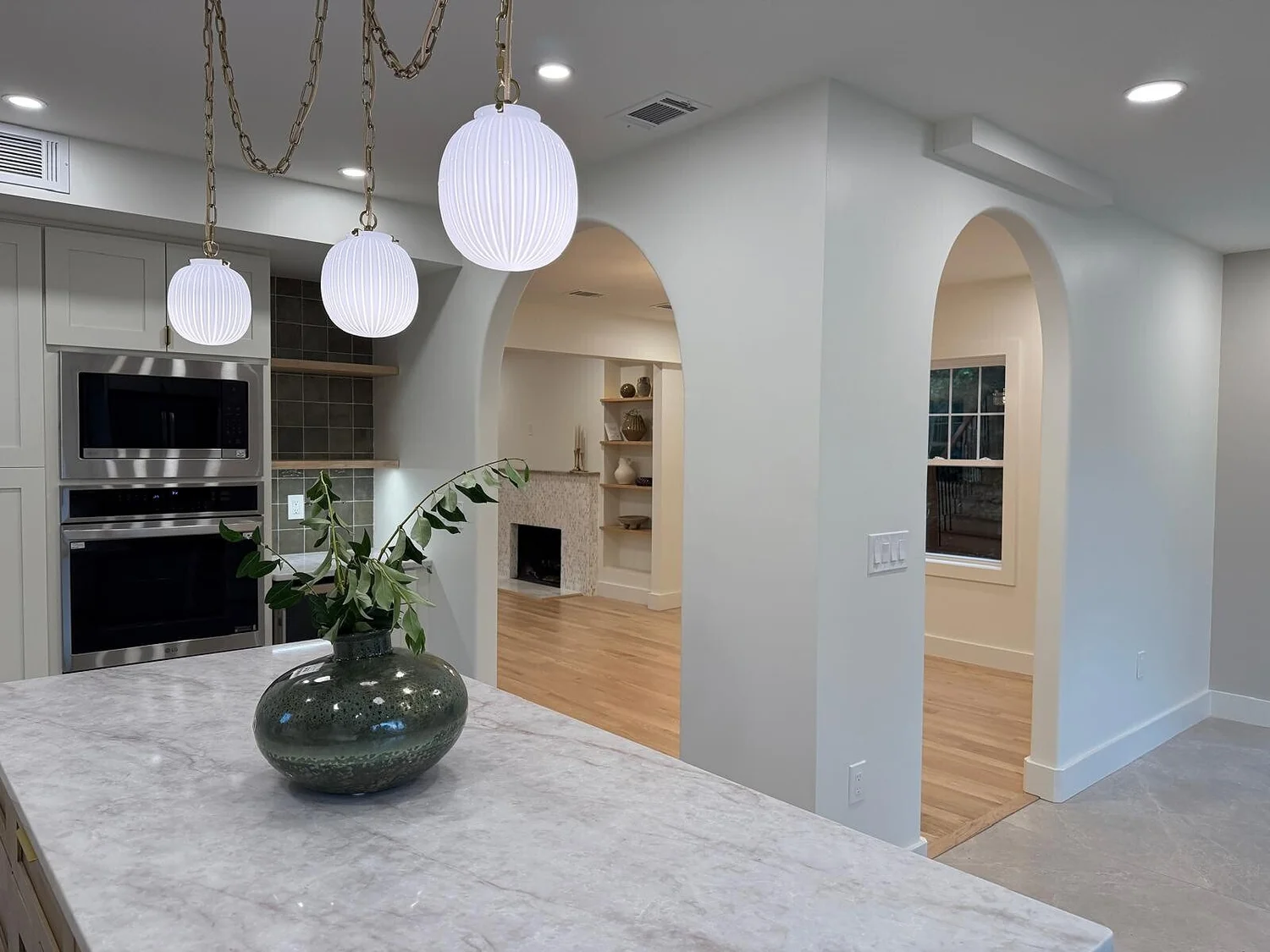 Queens Court whole-home renovation: open kitchen looking into the living room
